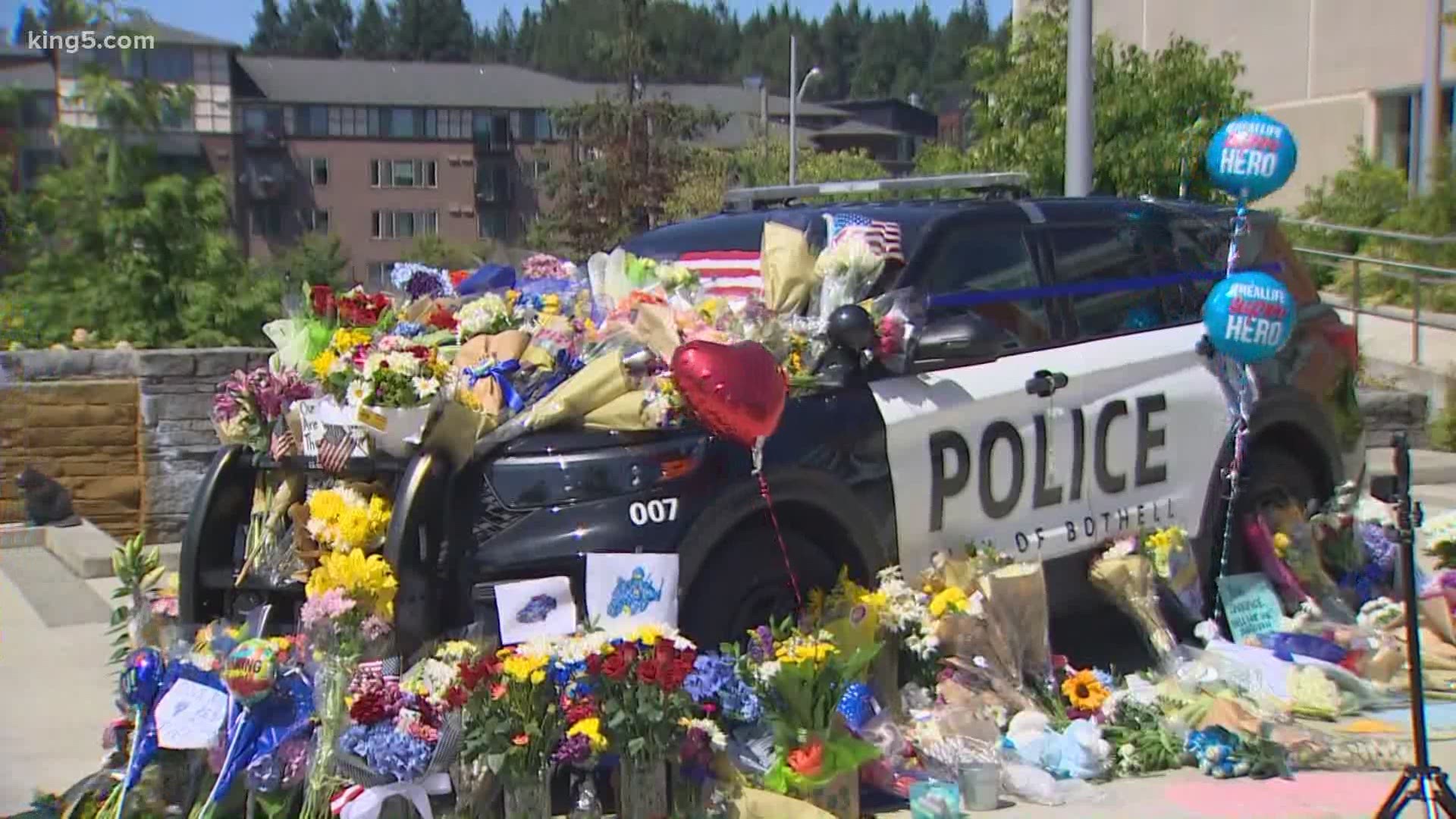 Two Bothell police officers were shot after a pursuit, and one of them died.