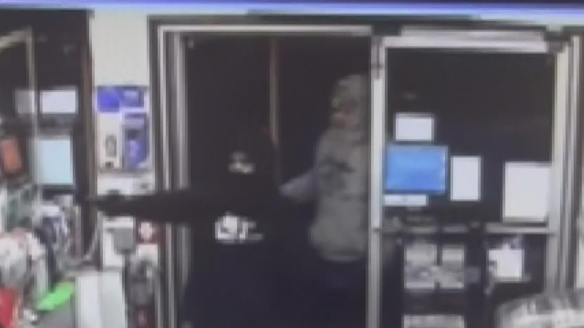 Two male suspects held up the store clerk at gun point and left with the store's cash and keys, and the clerk's purse.