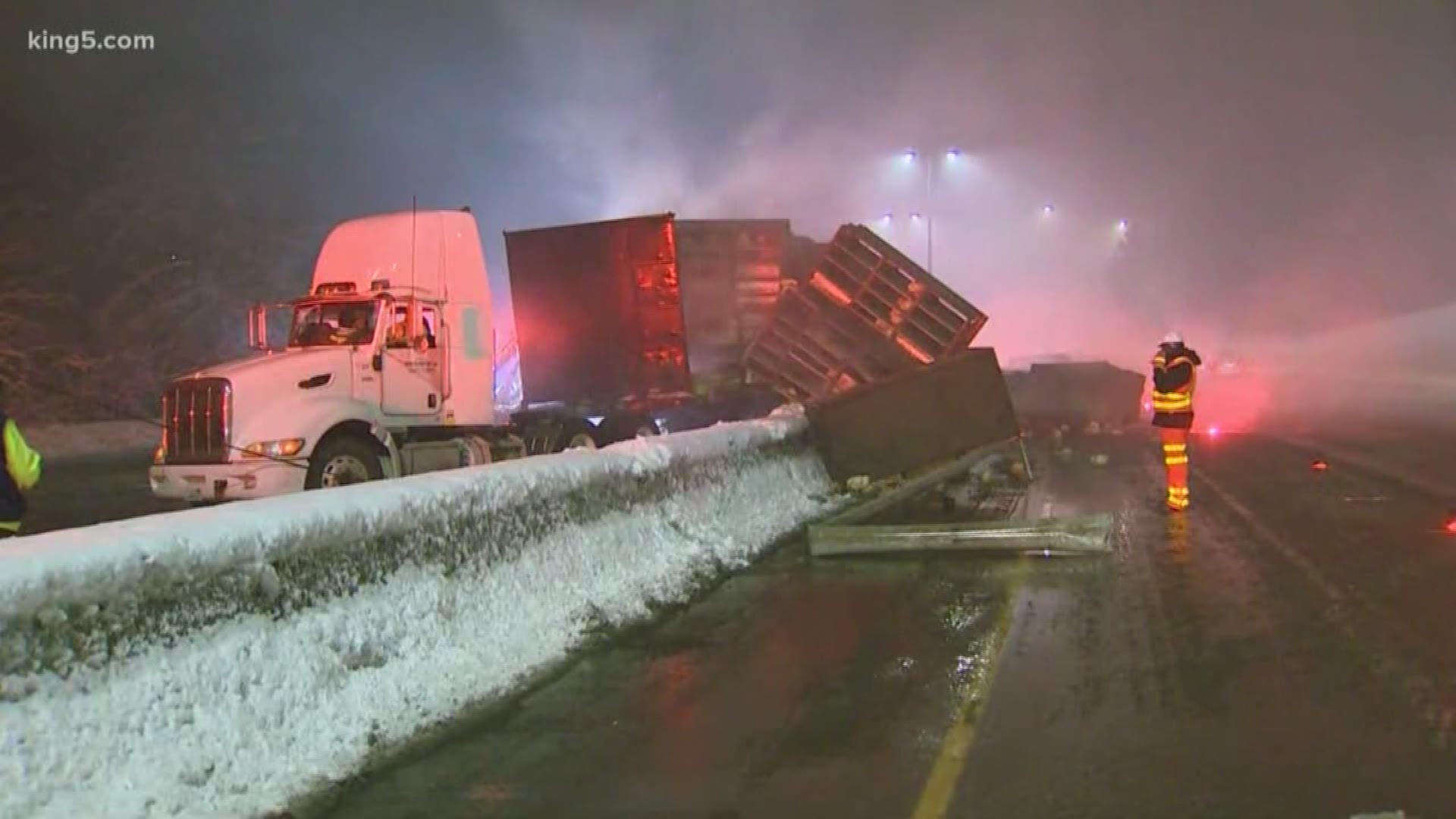 The jackknifed truck was carrying a trailer full of live chickens who got loose on the highway and had to be corralled.