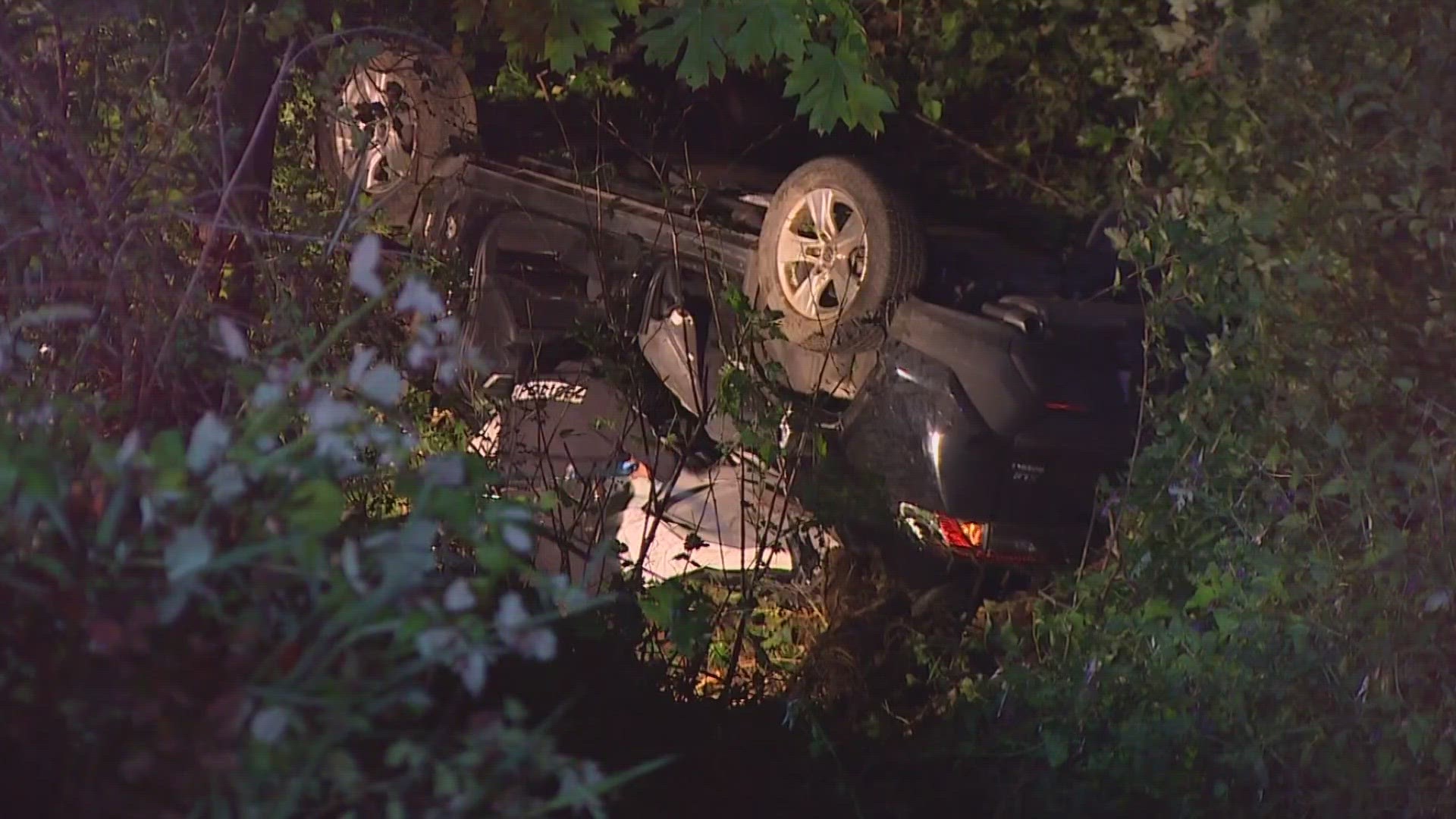 Two people were injured after their car flipped over into a ravine along 61st Ave. NE in Kenmore Wednesday morning.
