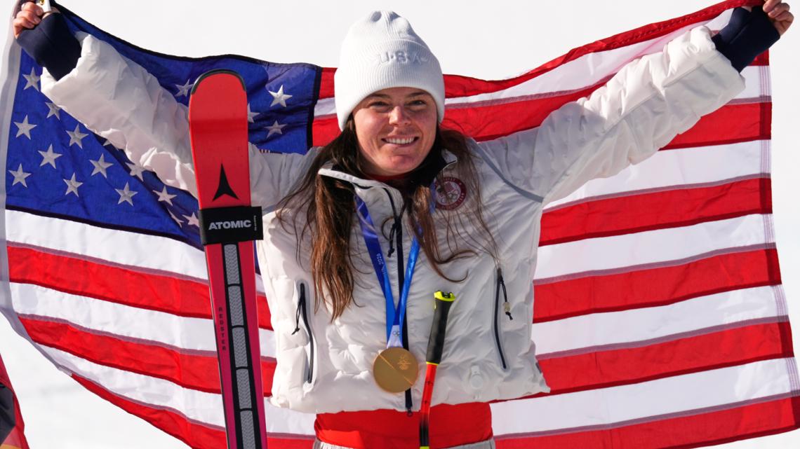 United States' Breezy Johnson celebrates winning a gold medal in the alpine ski women's downhill race, at the 2026 Winter Olympics on Feb. 8, 2026.