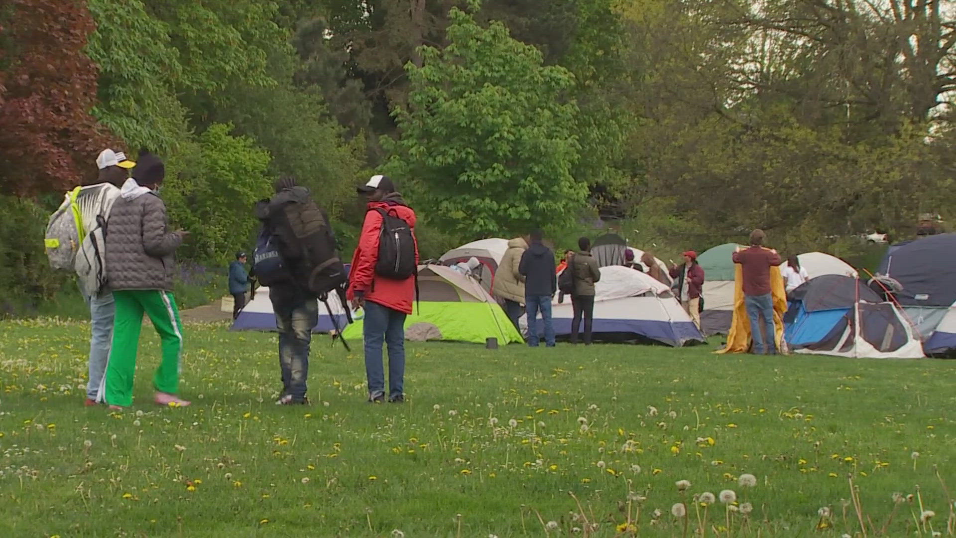 More than 100 asylum seekers, including many children, say they plan to camp in a Seattle park Monday night as hotel funding has run out.