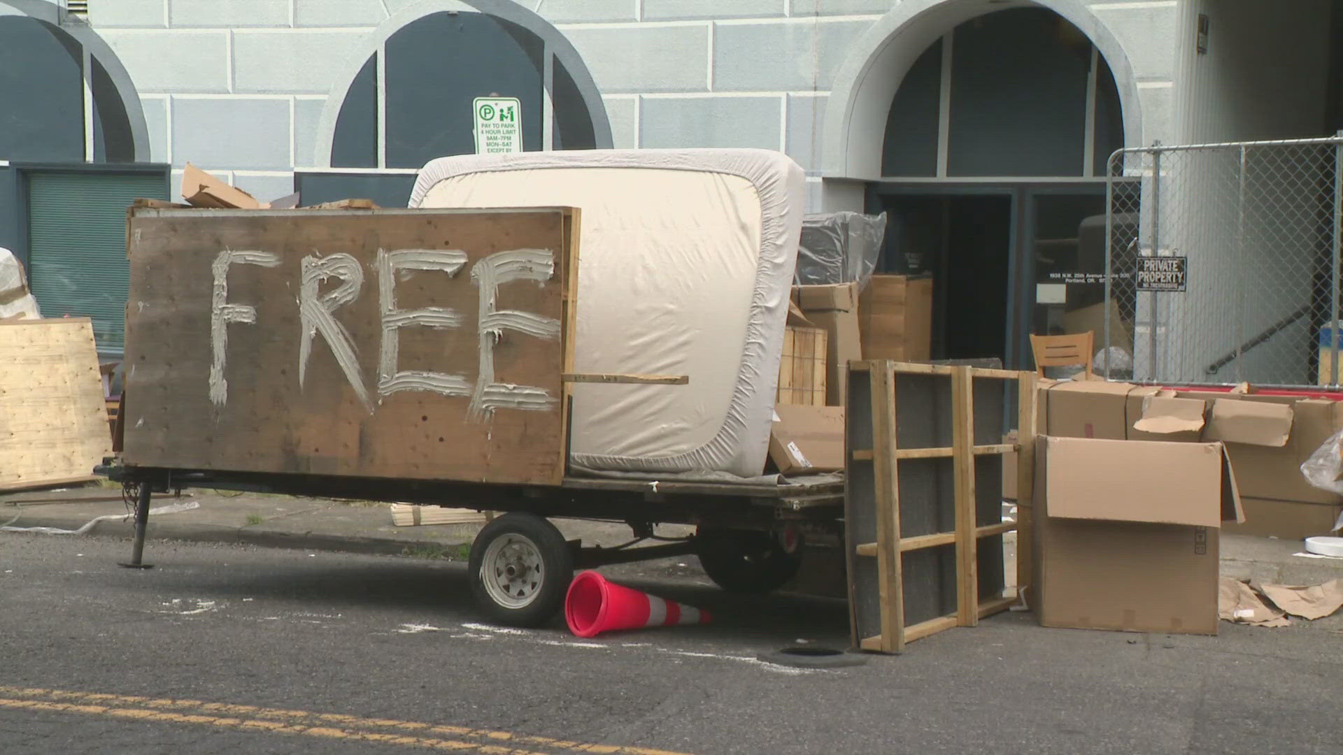 A plywood sign outside a Portland furniture warehouse that said "free" was not put up by the property owner and tricked people into taking items from inside