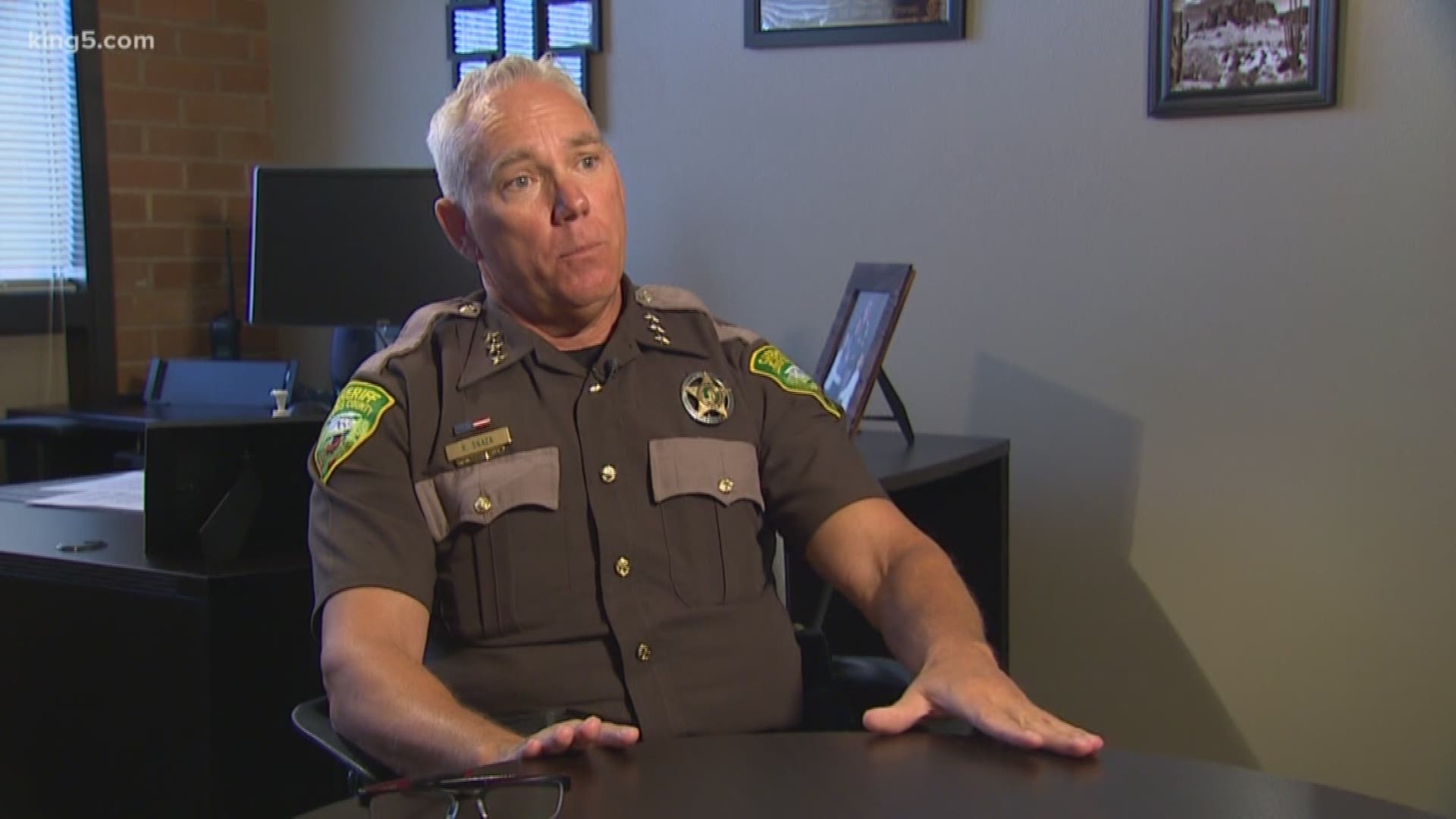 The Lewis County Sheriff doesn't agree with I-1639, one of the toughest gun laws in the country, but Sheriff Snaza says he will enforce it. KING 5's Drew Mikkelsen reports.