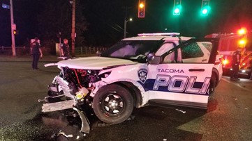 Driver arrested after running red light, crashing into Tacoma police vehicle