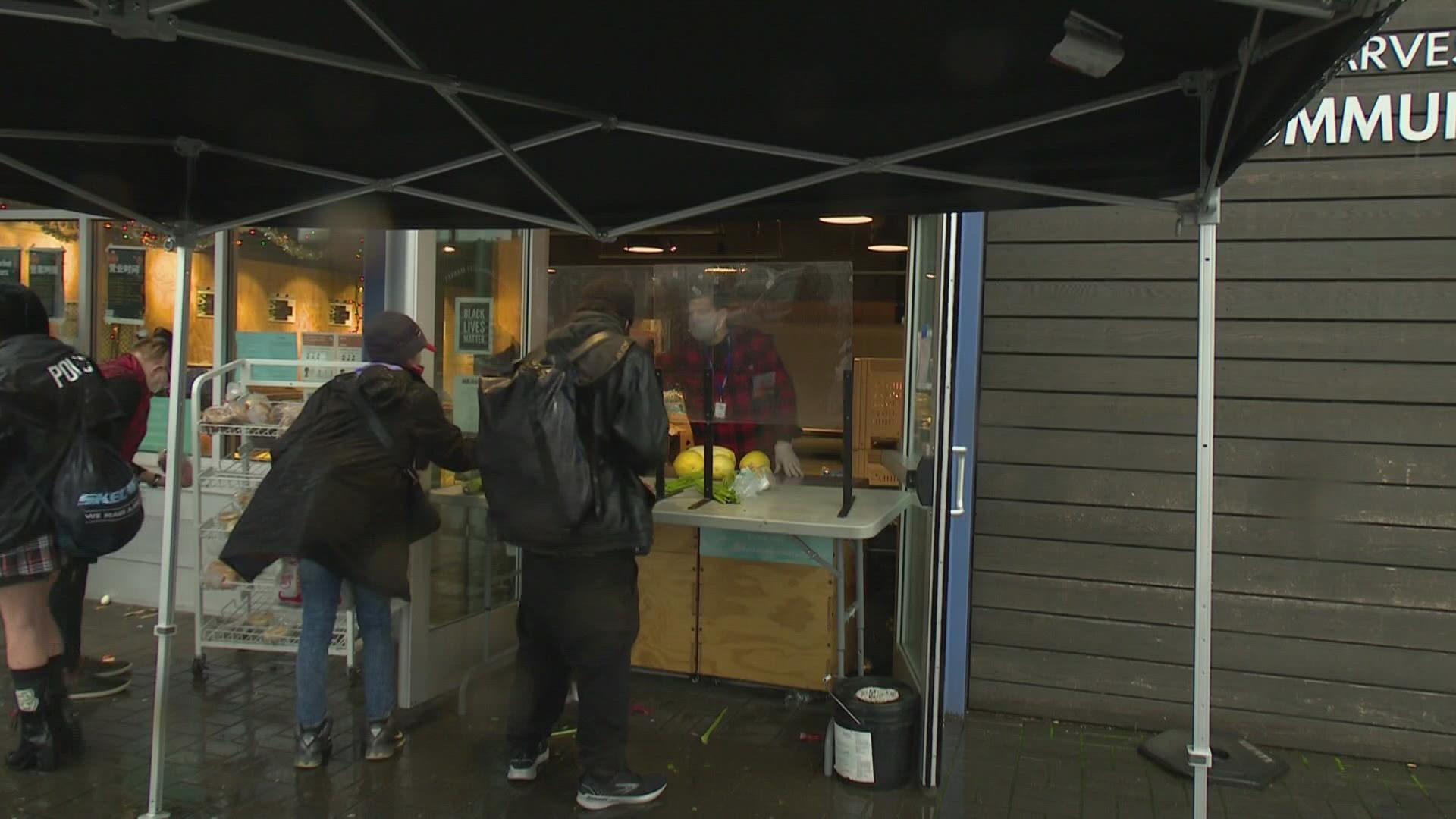 The SODO Community Market continues to serve about 1,000 people every Monday, Wednesday and Friday even with fewer helping hands.
