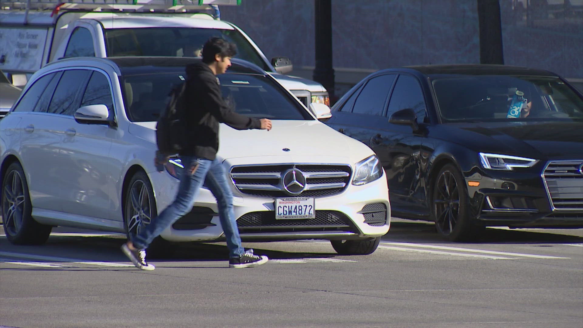 Cars blocking intersections in Seattle create a dangerous scenario for pedestrians trying to cross