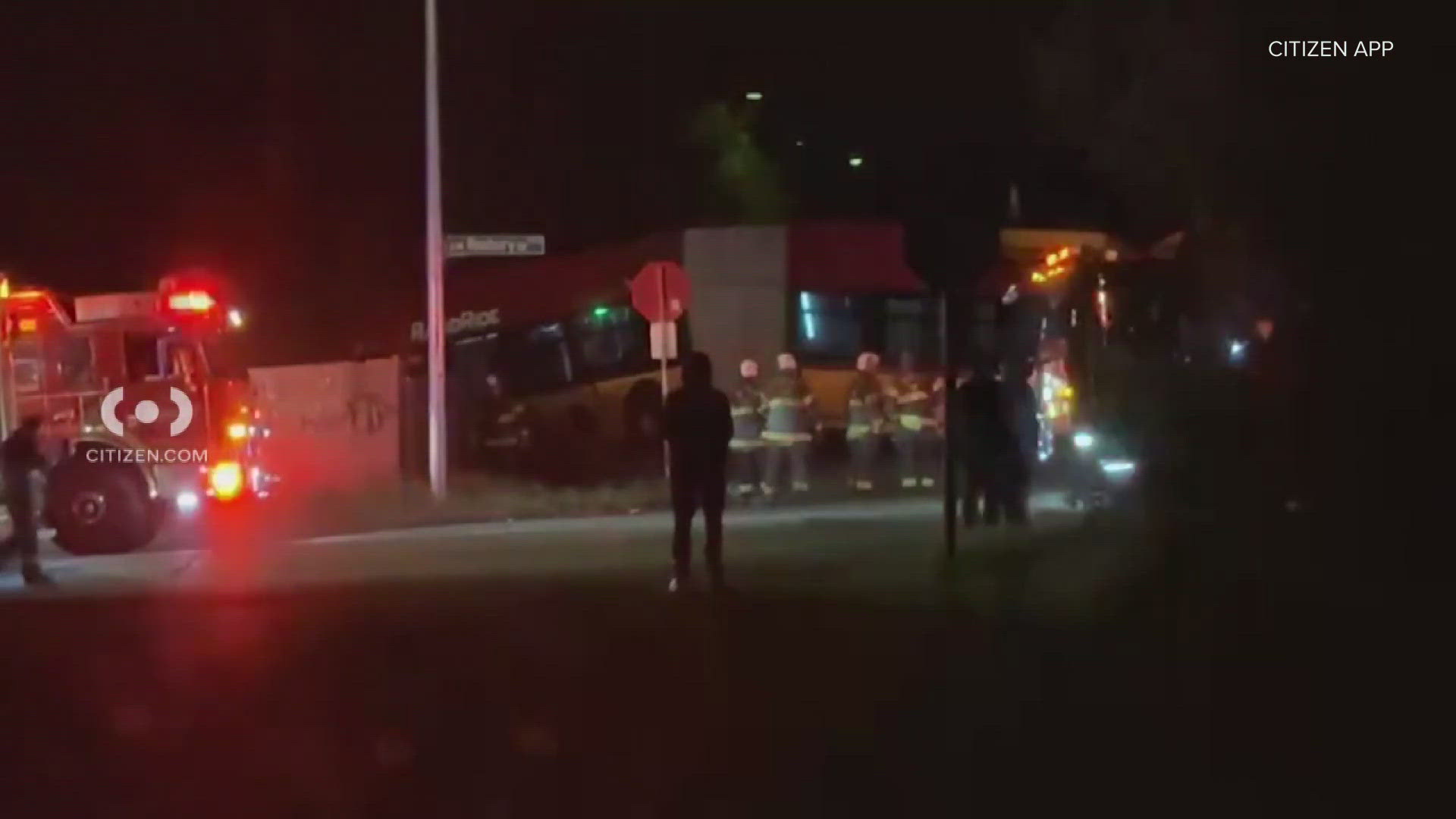 Police said the bus driver swerved to avoid hitting an object on the road but the bus drove through a fence and was left hanging off of an 8-foot ledge.