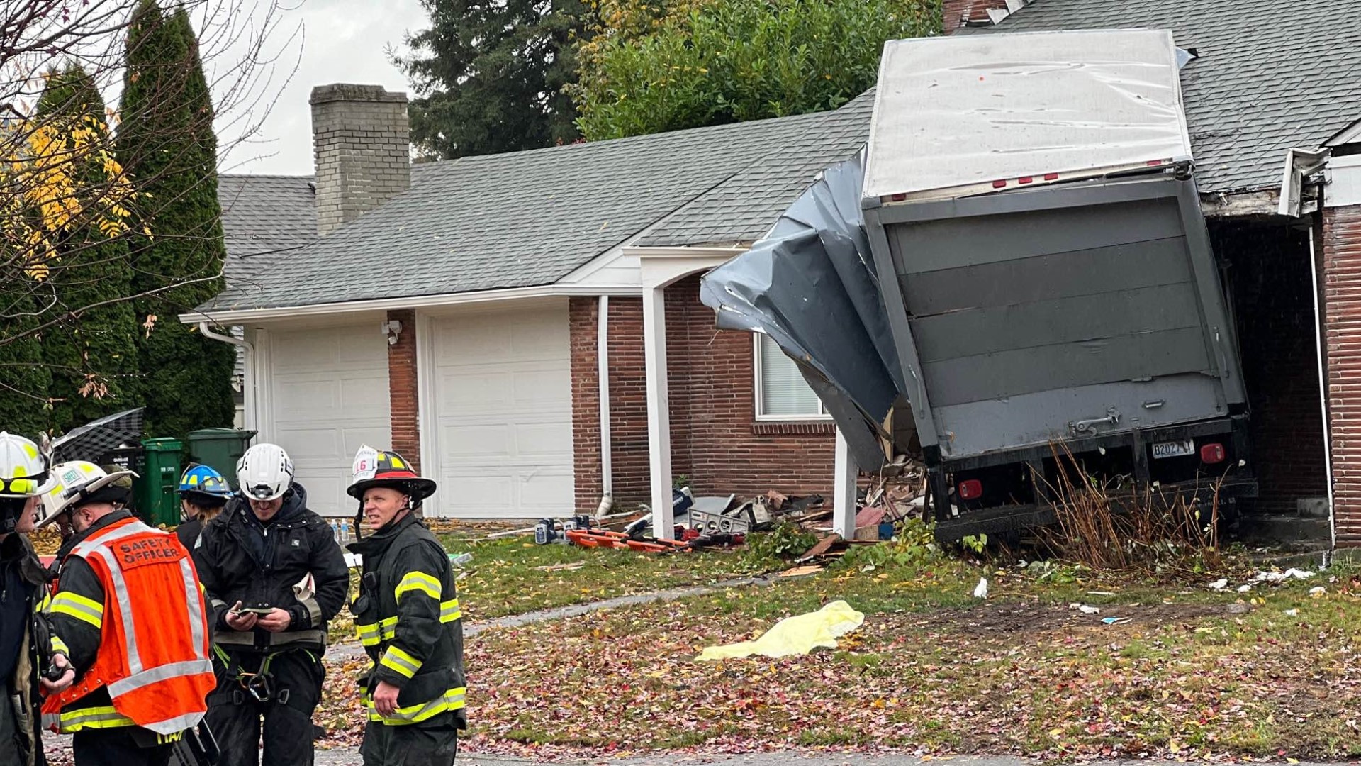 Seattle Fire said one passenger in the truck got himself out, and the driver had to be extricated.