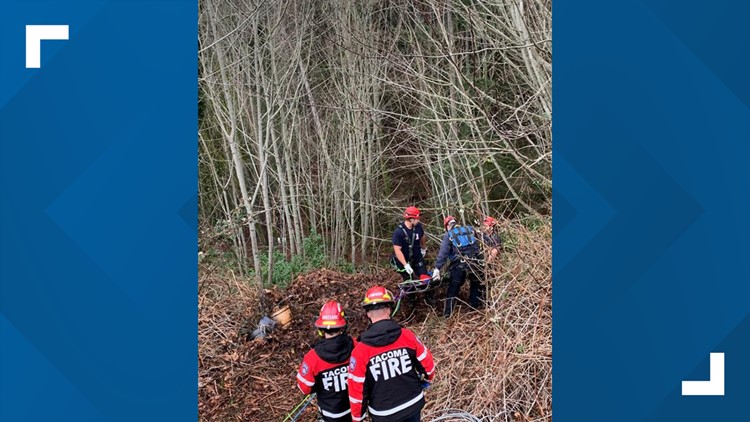 Crews rescue two people after car goes over embankment in Tacoma