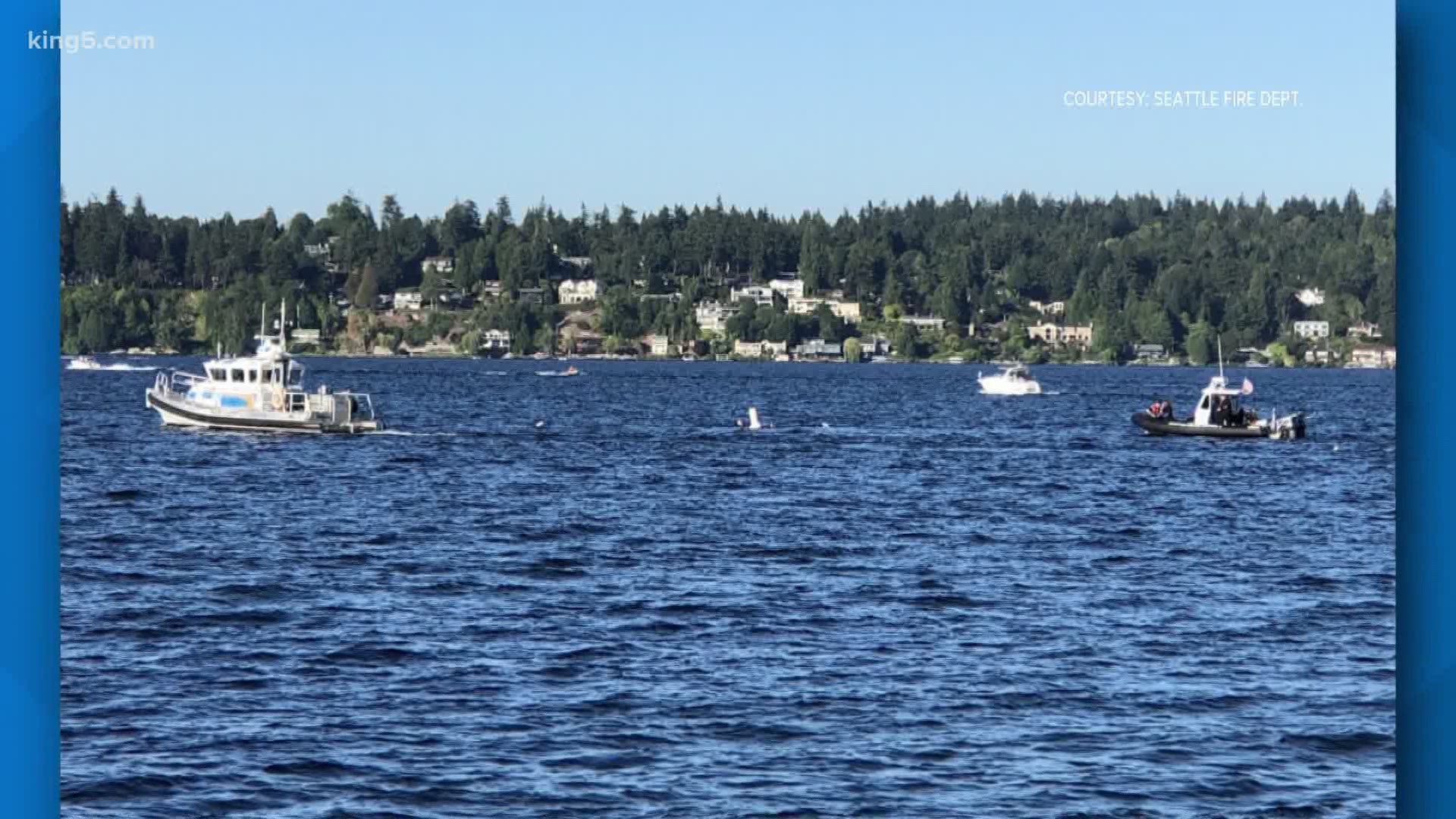 Dive teams were unable to find two people who went missing in the waters of Lake Washington Sunday.