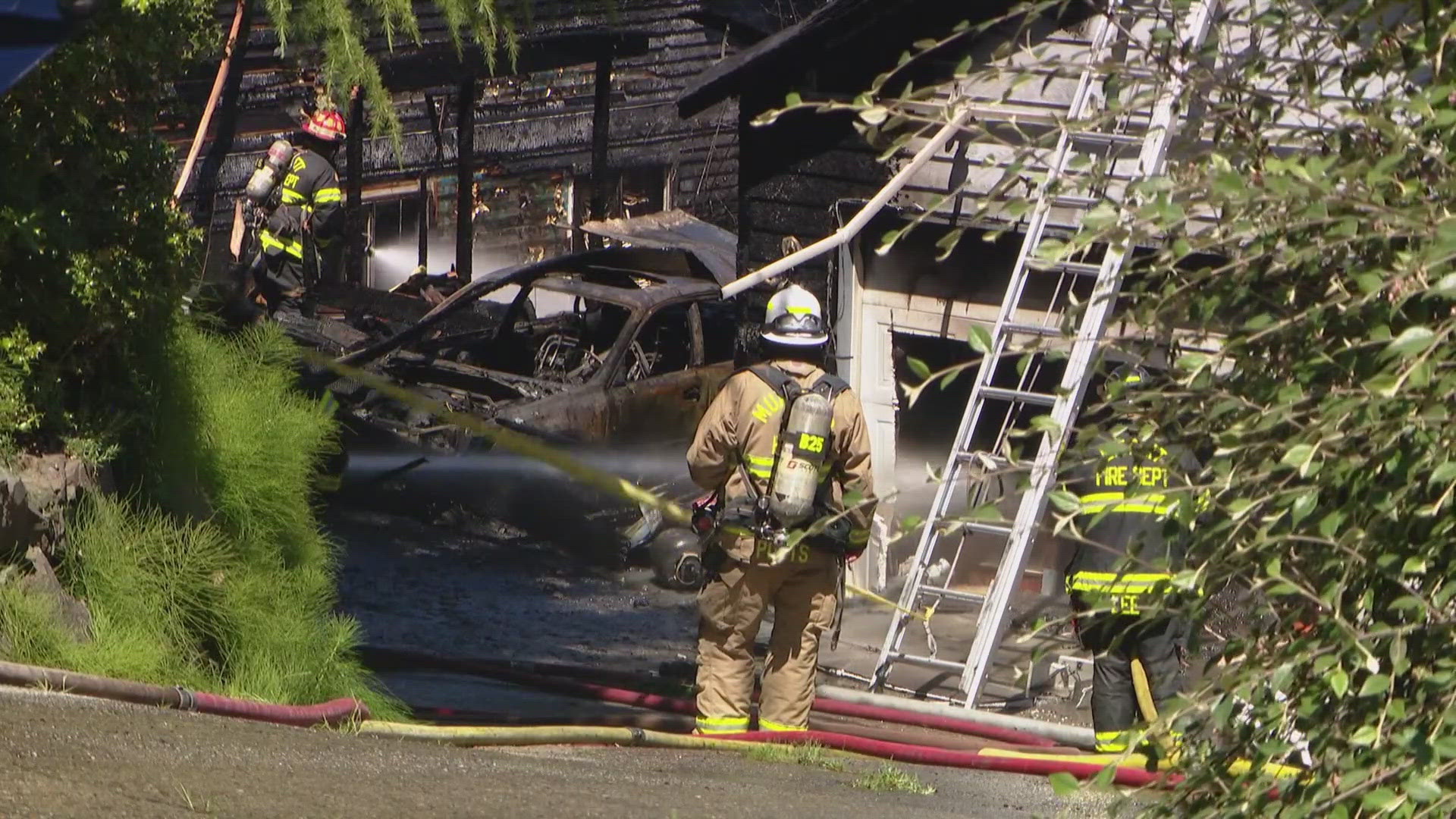 Two firefighters were injured Thursday afternoon while crews worked to extinguish two house fires in Everett's Valley View neighborhood.