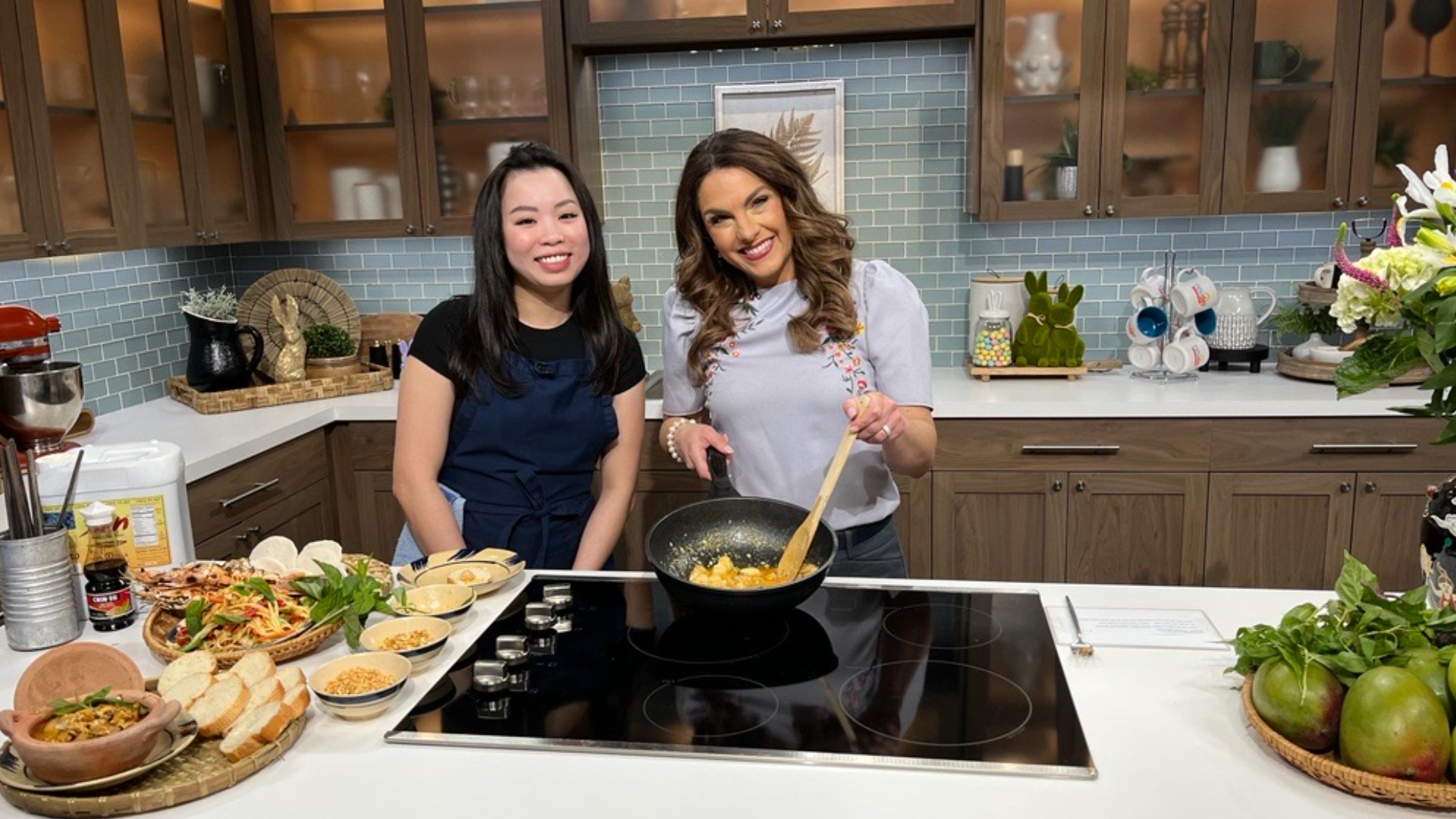 XOM's Sammy Nguyen shows Amity how to prepare one of their popular dishes. #newdaynw