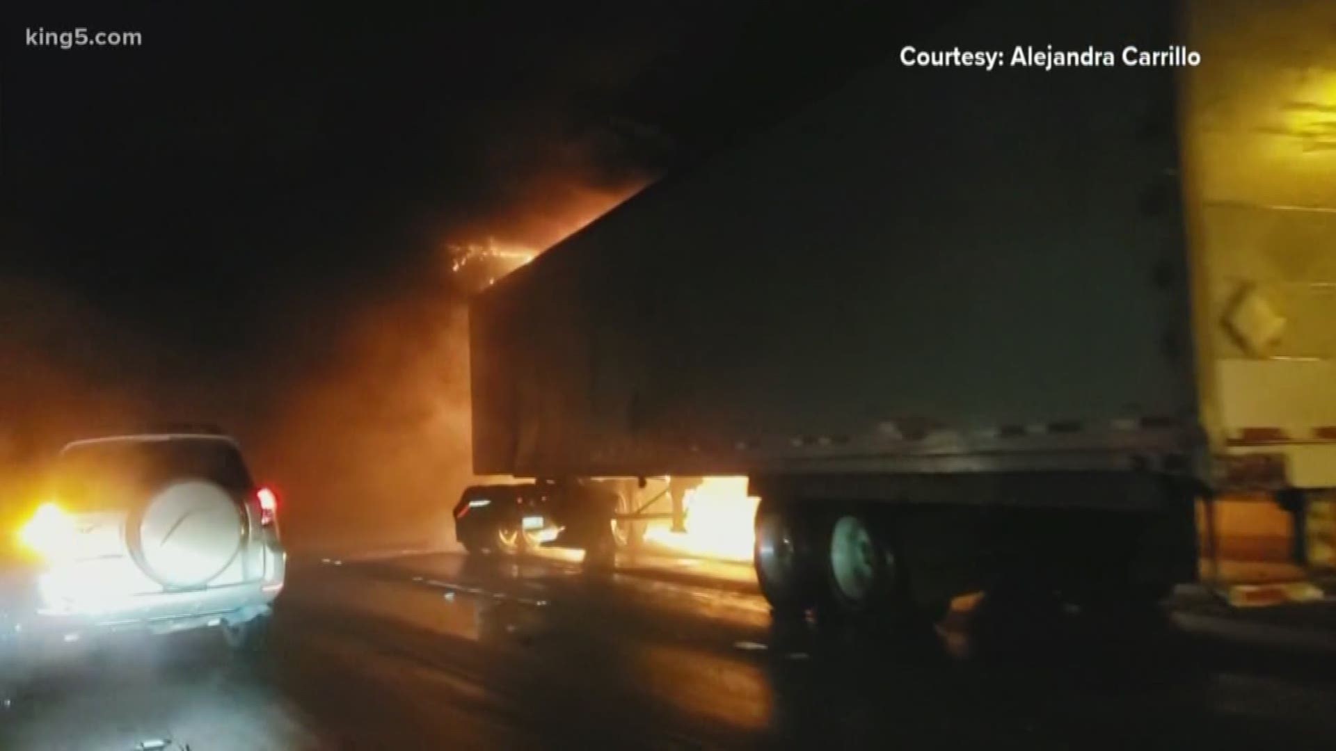 The driver of a semi-truck was cited for negligent driving after the rig crashed and caught fire on the southbound I-5 express lanes in Seattle early Friday morning.