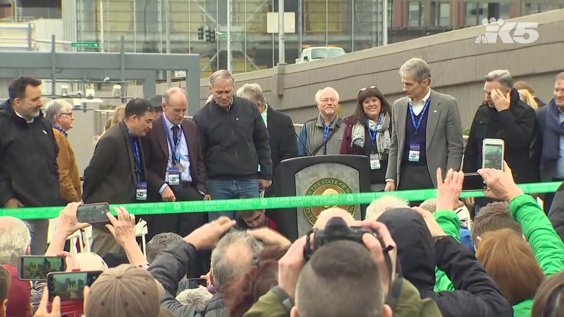 Gov. Jay Inslee cuts the ribbon for the State Route 99 tunnel in Seattle on February 2, 2019.
