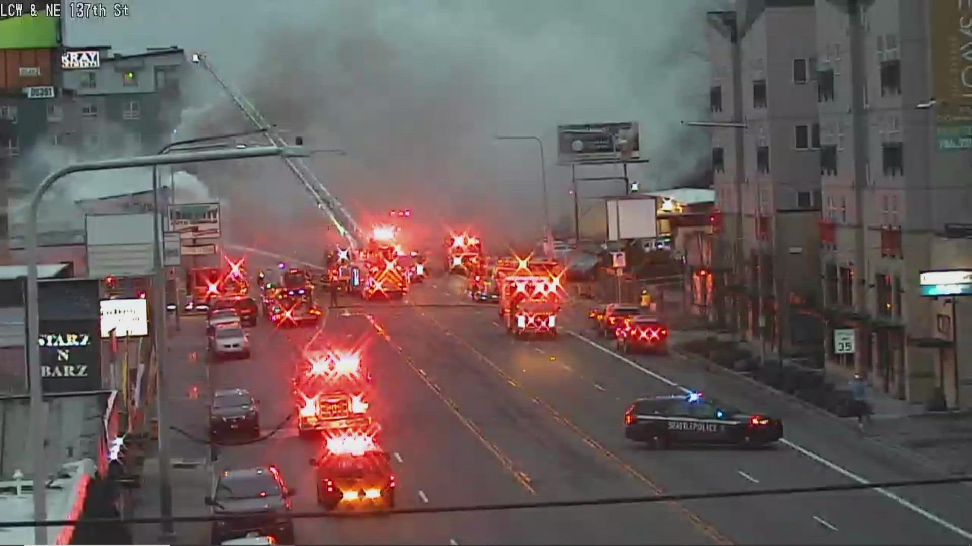 An abandoned building in Seattle's Lake City neighborhood has roads blocked at the corner of Lake City Way and 137th St.