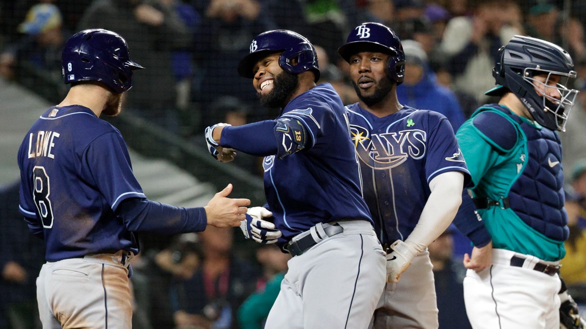 Brandon Lowe of the Tampa Bay Rays celebrates with teammates Randy