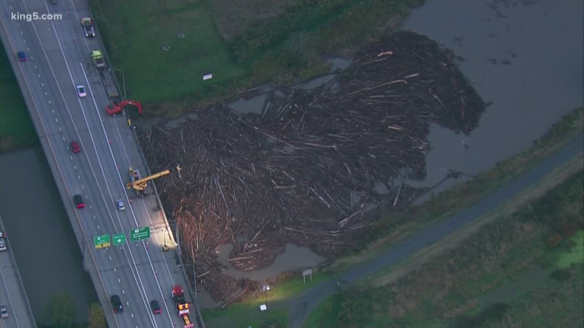 WSDOT said drivers should plan for delays through the Wednesday morning commute as their crews continue to clean up debris caused by a log jam.