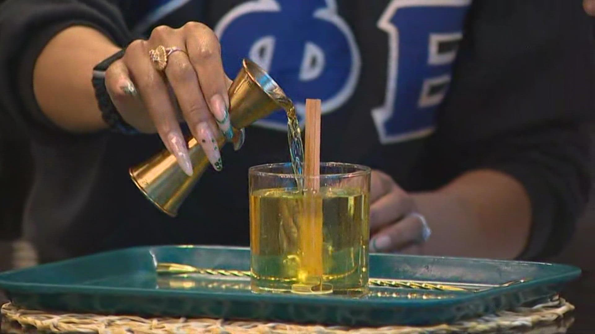 Colina Bruce, owner of Belltown's Noir Lux Candle Bar, teaches KING 5's Farah Jadran how to make a candle.