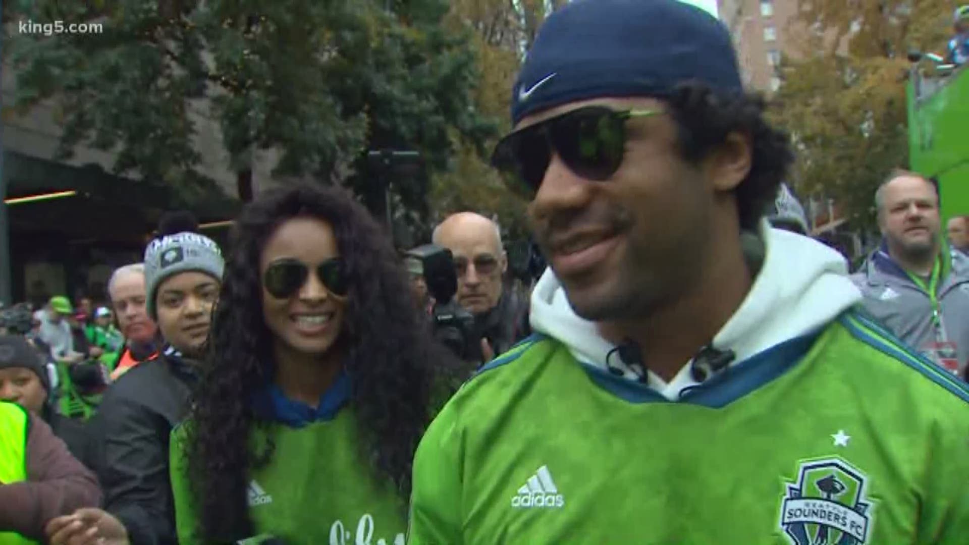 Chris Daniels talks with Russell Wilson and Ciara.
