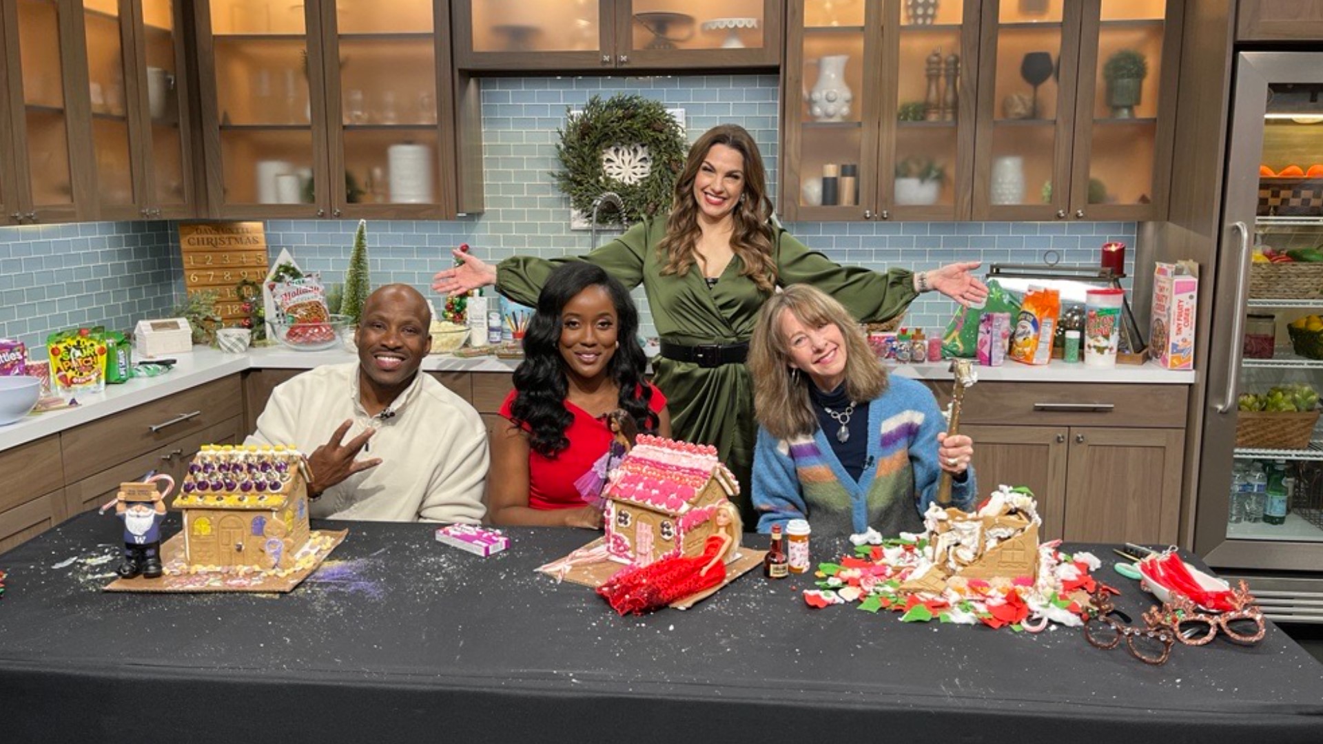 KING 5's Shante Sumpter, Terry Hollimon and Nancy Guppy from "Art Zone" compete for the coveted Golden Hammer in our annual gingerbread house competition.