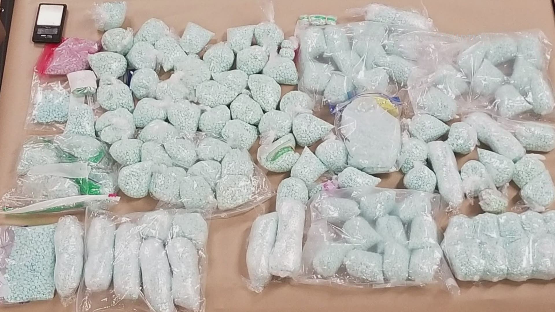 SPD seized 410,000 counterfeit oxycodone pills, which contained fentanyl, 77 pounds of meth, 908 grams of heroin, 787 grams of cocaine, guns and nearly $250,000.