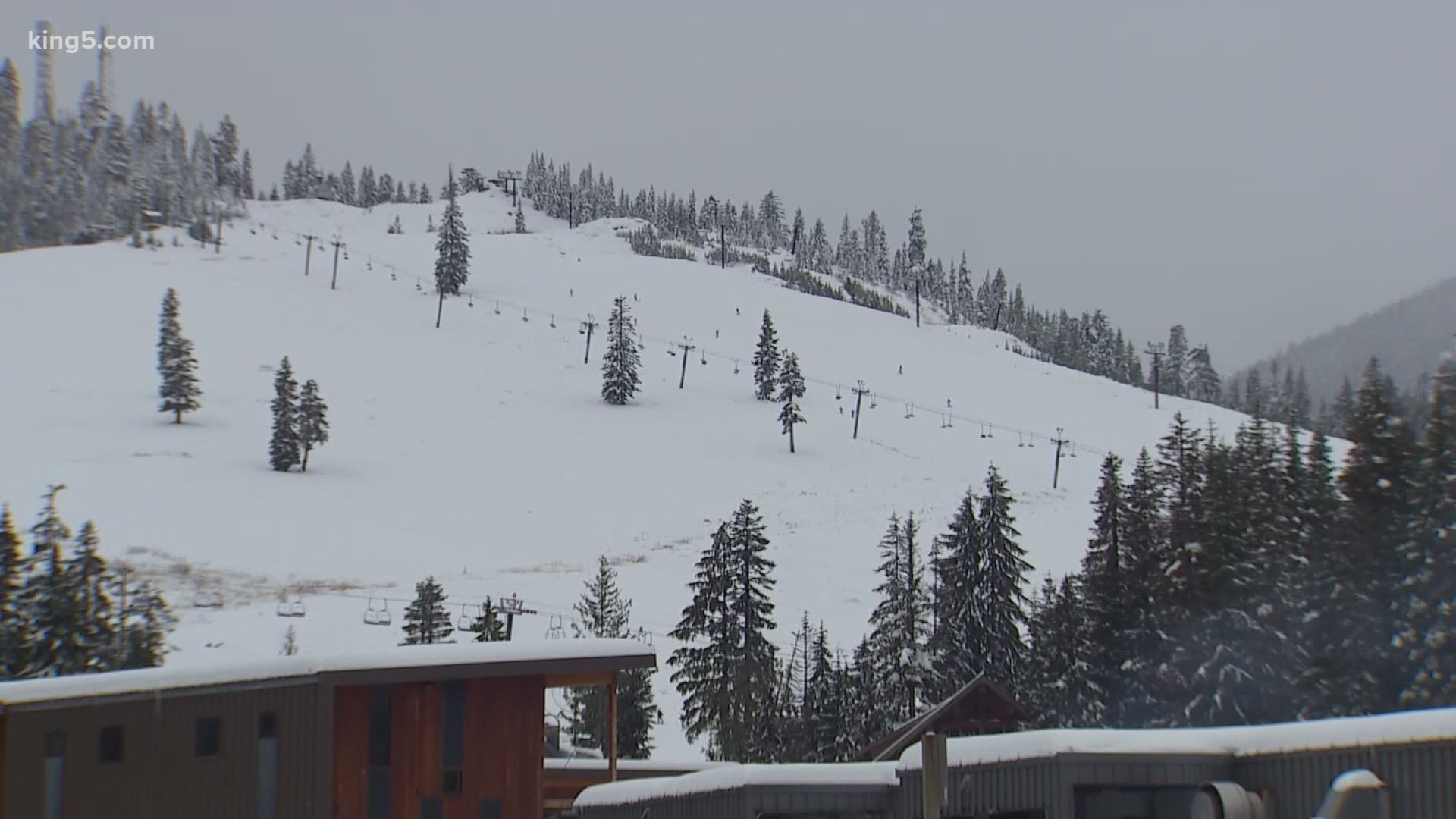 People enjoyed the snow at Snoqualmie Pass on Saturday. The forecast shows a break Sunday and then more rain and wind on the way to start the week.