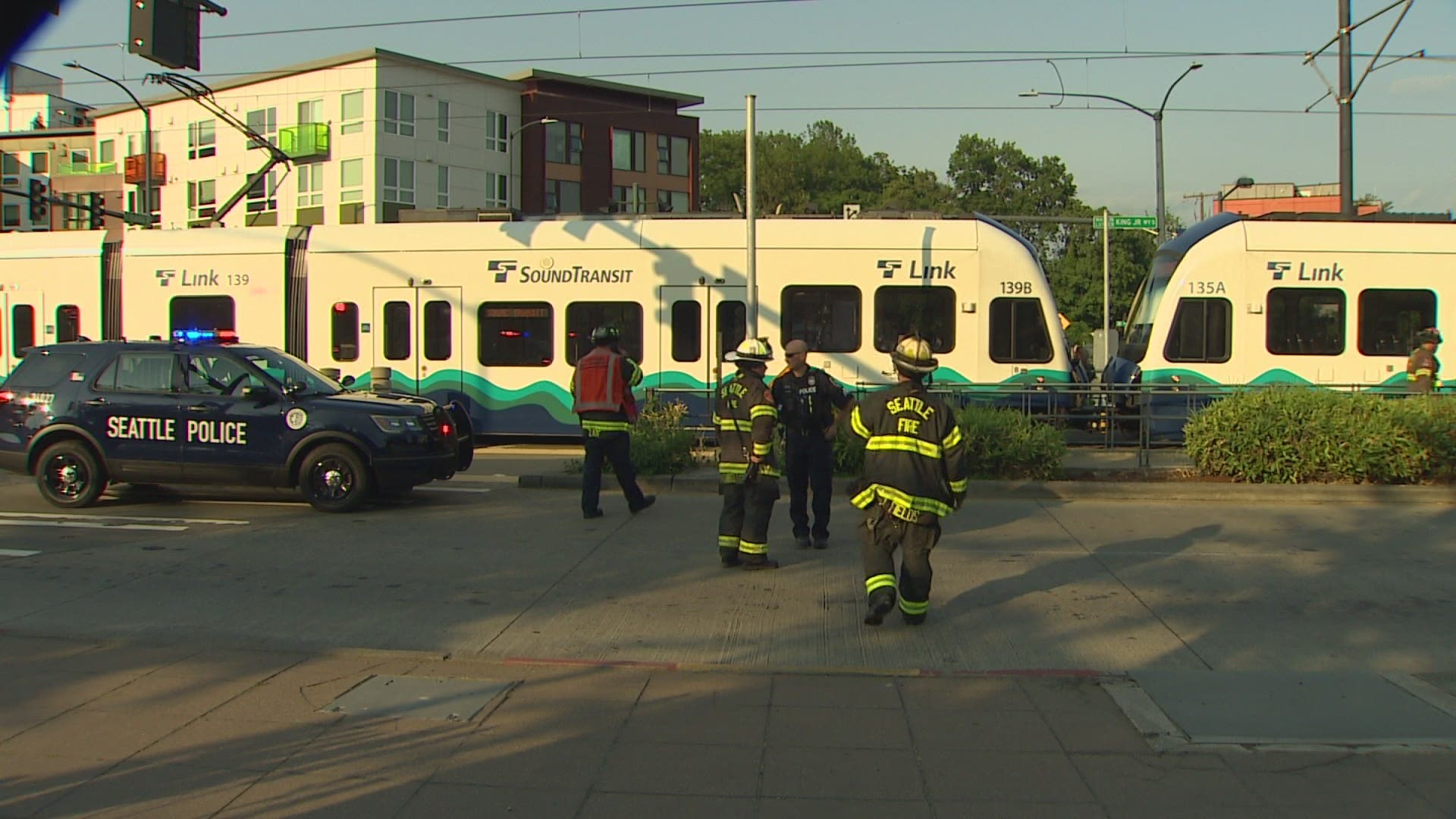 Two people who were trapped underneath a light rail train in Seattle were extricated. Both victims died from their injuries.