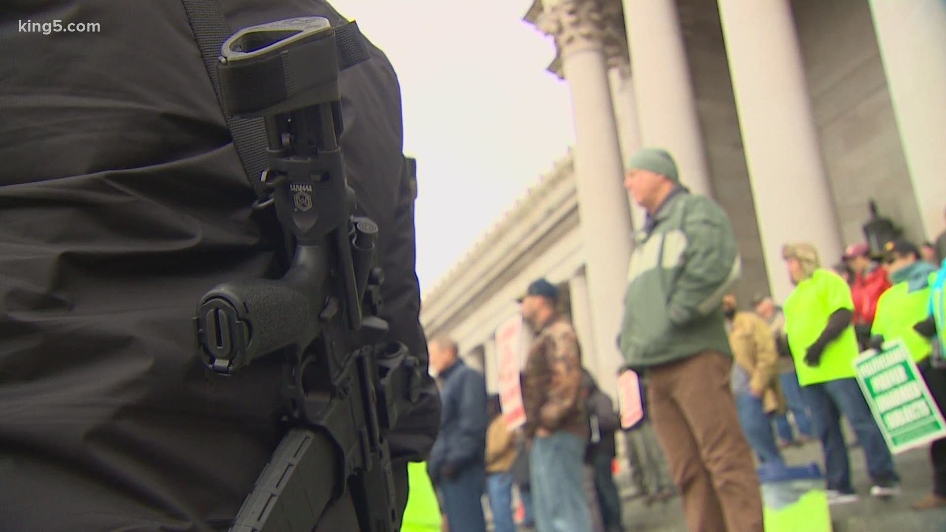 The ban on carrying guns openly would extend to any demonstration across the state. Opponents say that would be unconstitutional.