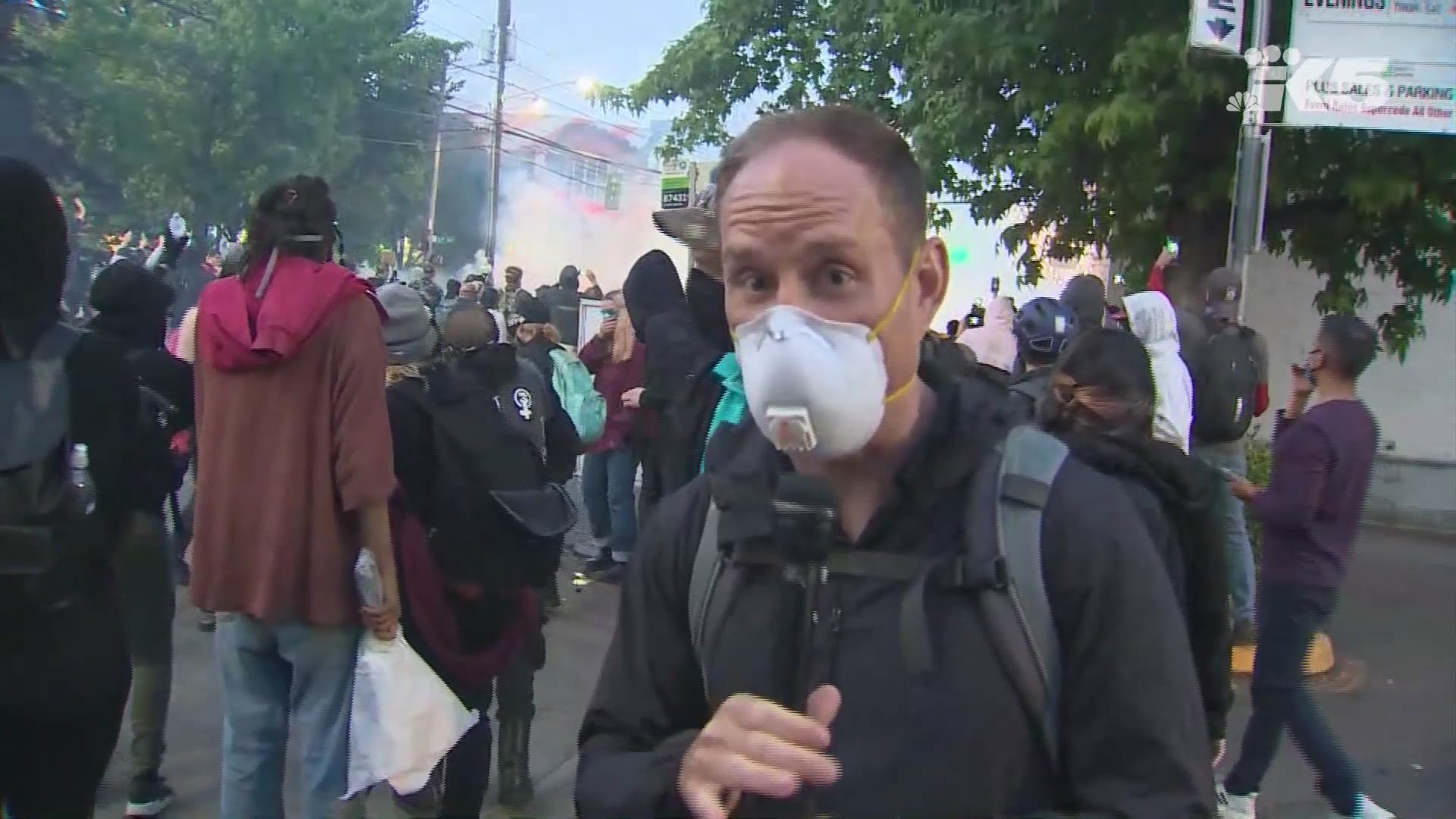 KING 5 reporter Ted Land was on the ground in Capitol Hill when tear gas and flashbangs were deployed in what was ultimately labeled a "riot" by police.