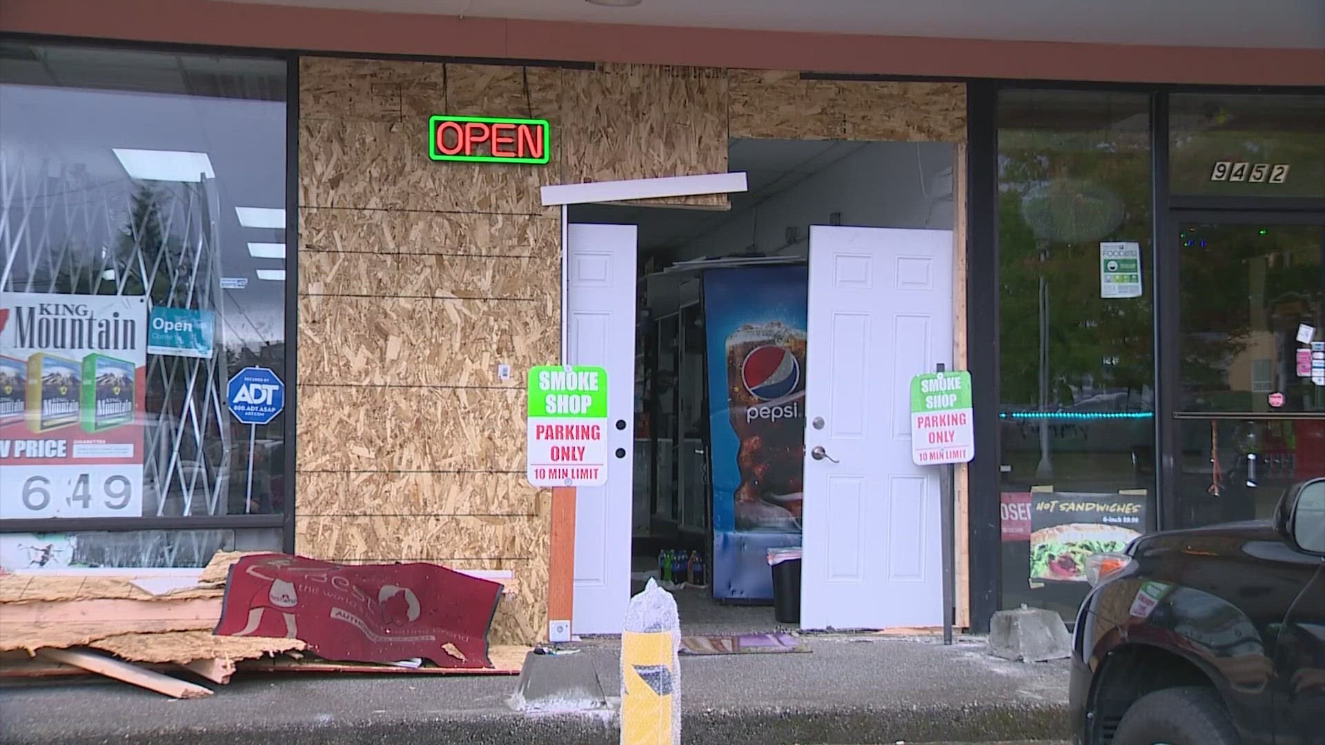The smoke shop was also hit with a smash-and-grab on Tuesday morning. The business owner had just finished boarding up the storefront.