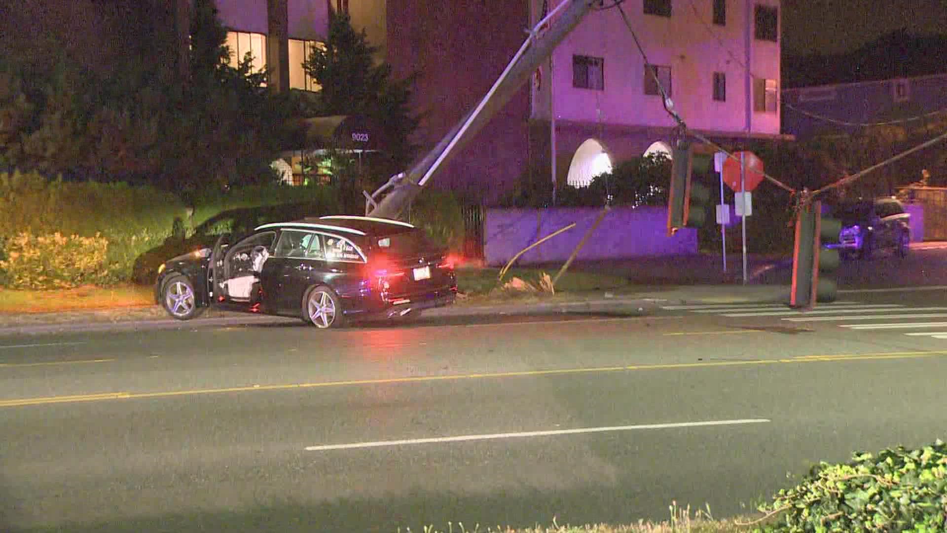 Holman Rd in north Seattle is closed in both directions at Mary Ave after a car crashed into a pole