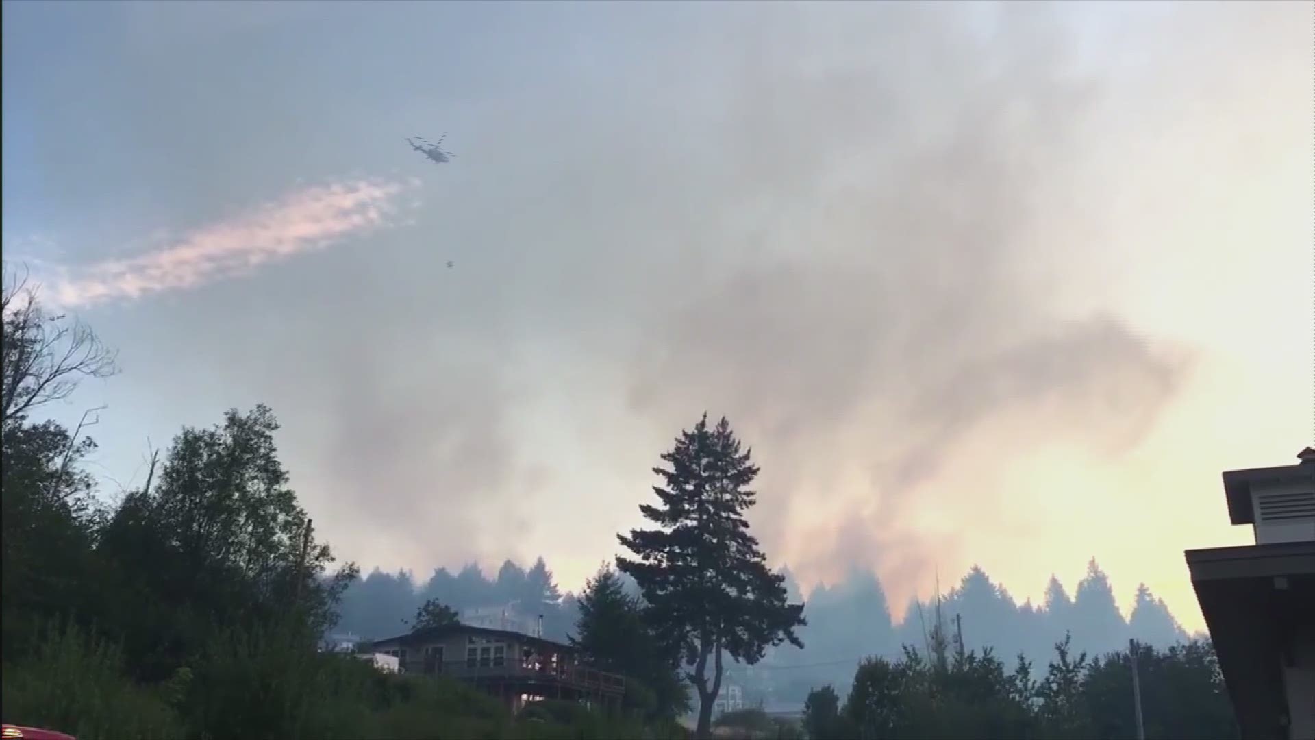 A Department of Natural Resources helicopter dropped water on a brush fire in Mason County Thursday evening. The fire caused Level 3 evacuations for some residents.