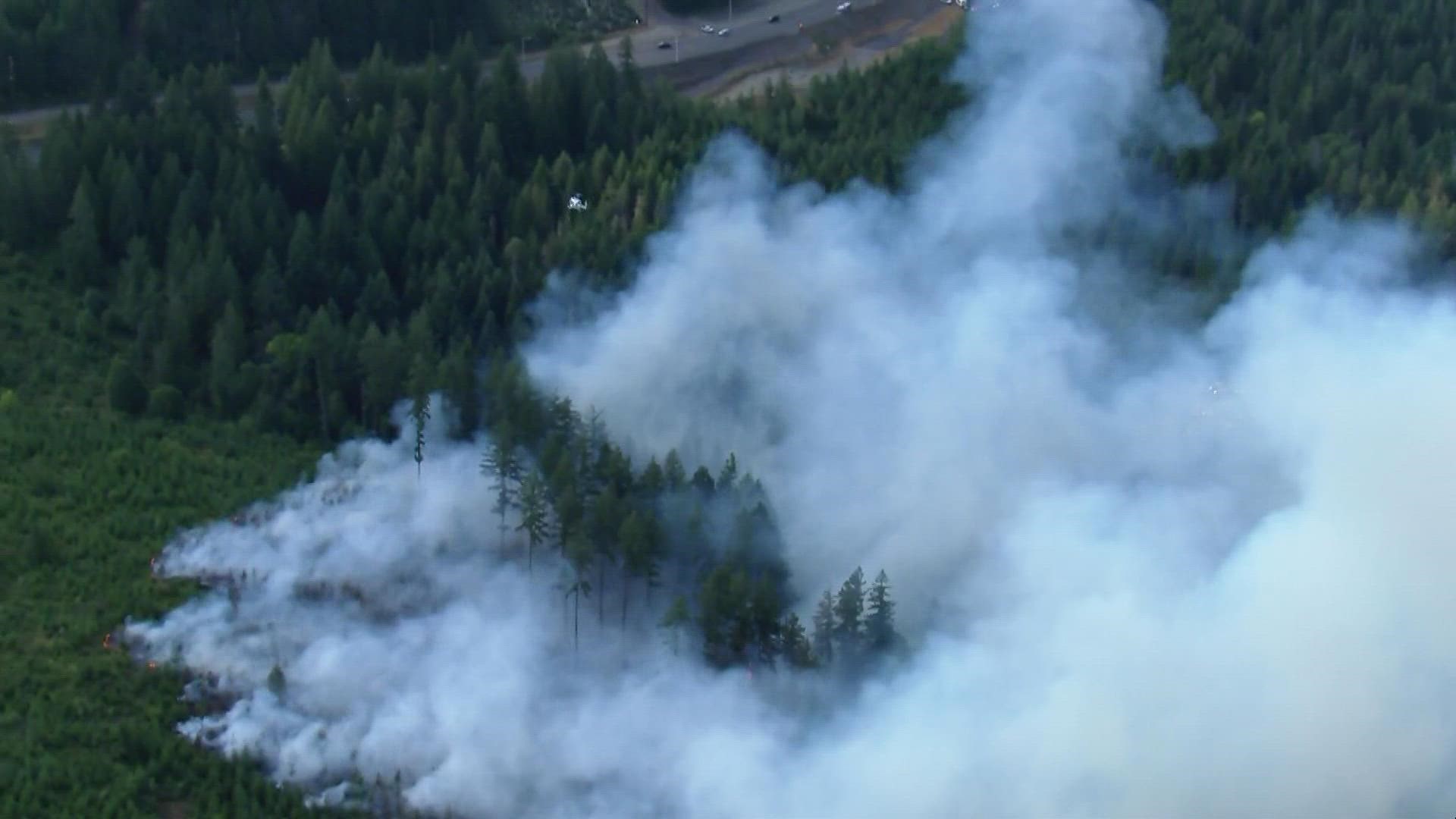 Firefighters are battling a large brush fire burning in difficult terrain in Bonney Lake on Thursday, Aug. 5, 2021.