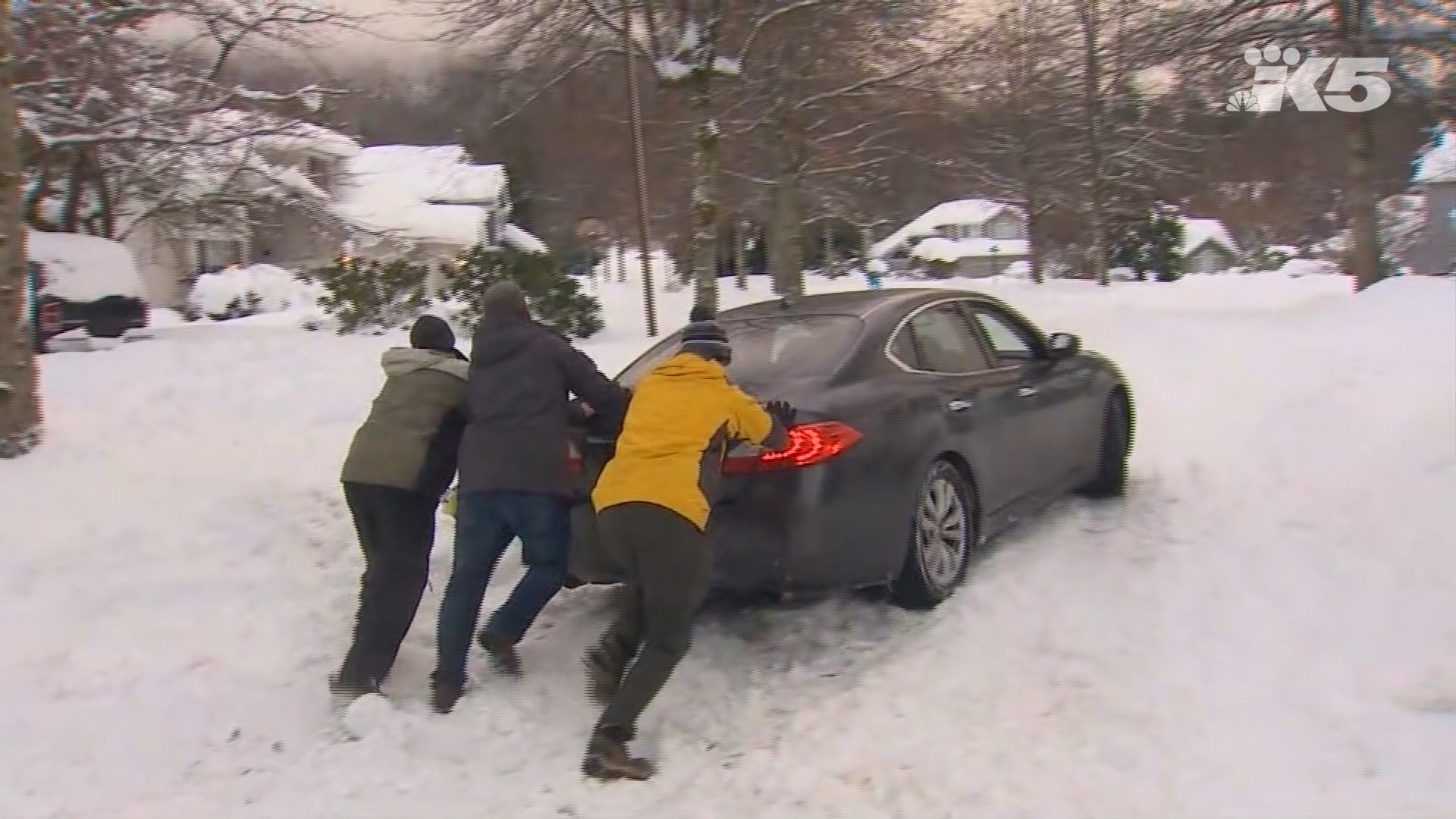 KING 5 Meteorologist Ben Dery helped some North Bend residents get their car unstuck from some deep snow.