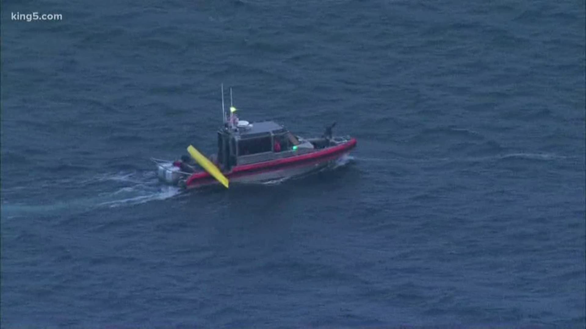 The U.S. Coast Guard is searching for the missing paddler.  One other person was already rescued.