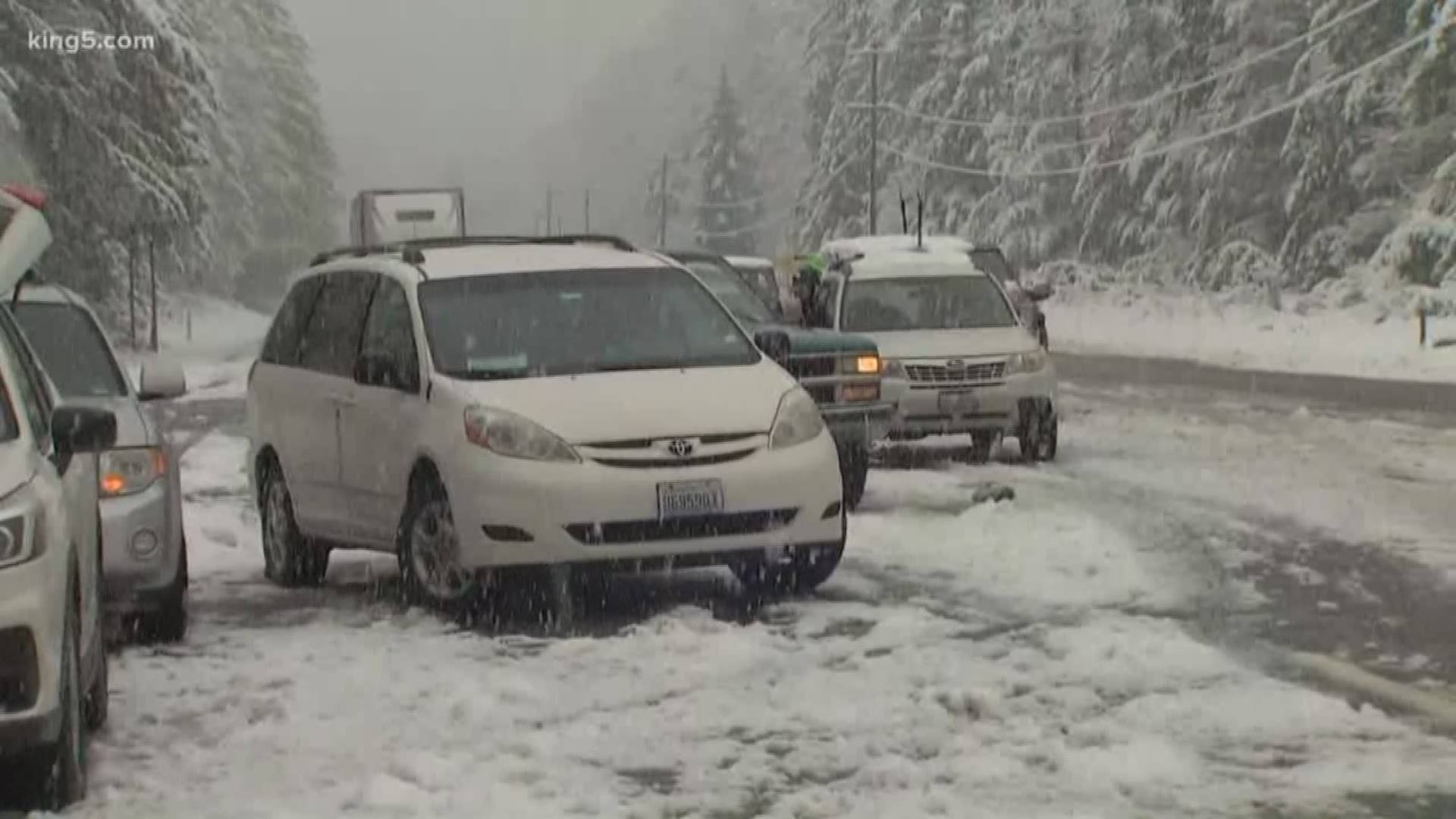 US Highway 2 over Stevens Pass closed in both directions Sunday night due to downed trees and power lines blocking the roadway.