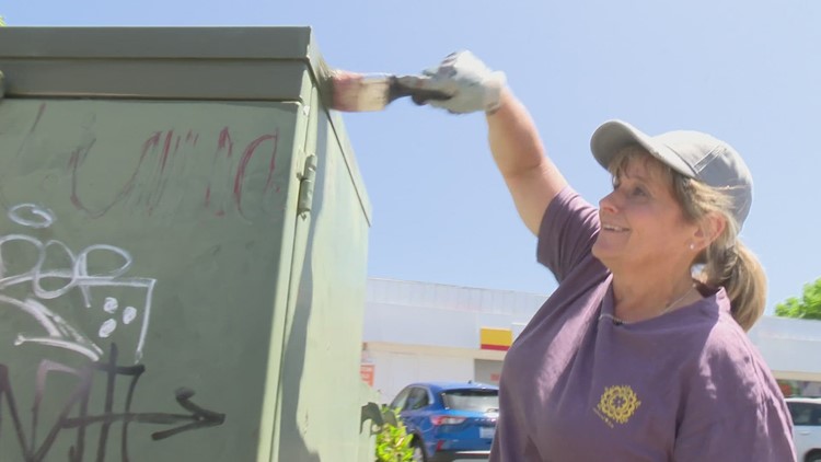 Community members and Tukwila police officers team up to remove recent graffiti