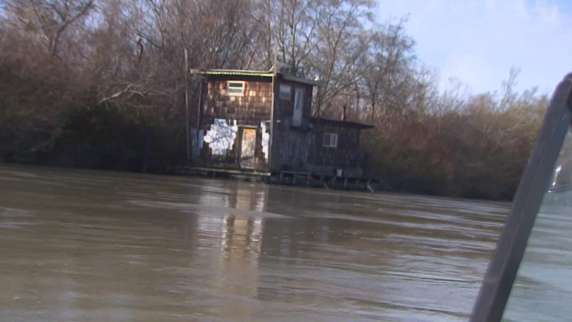 Despite "very adverse conditions," Johnn Anderson's house boat held together when it was swept 5 miles down stream.