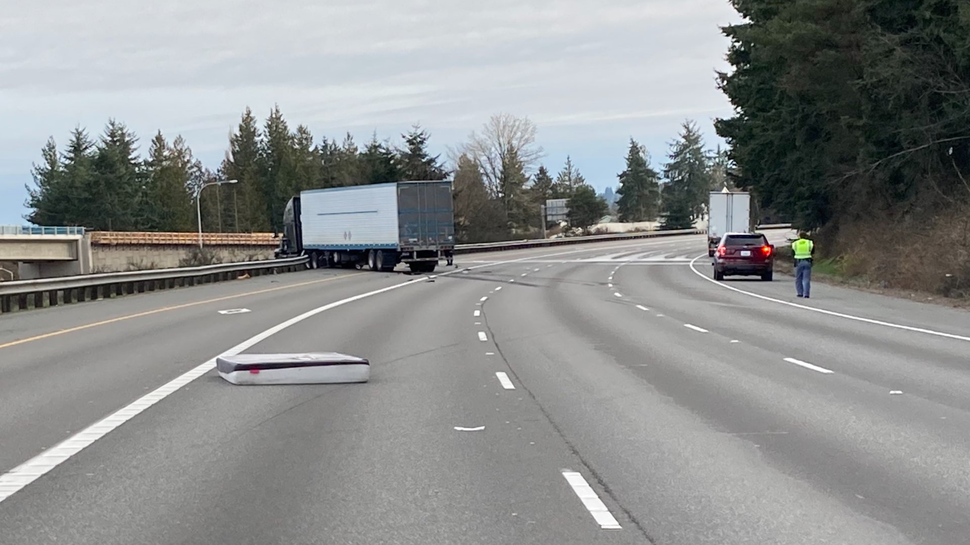 The crash happened around 6:30 a.m. when a mattress fell off a truck, according to the Washington State Patrol.