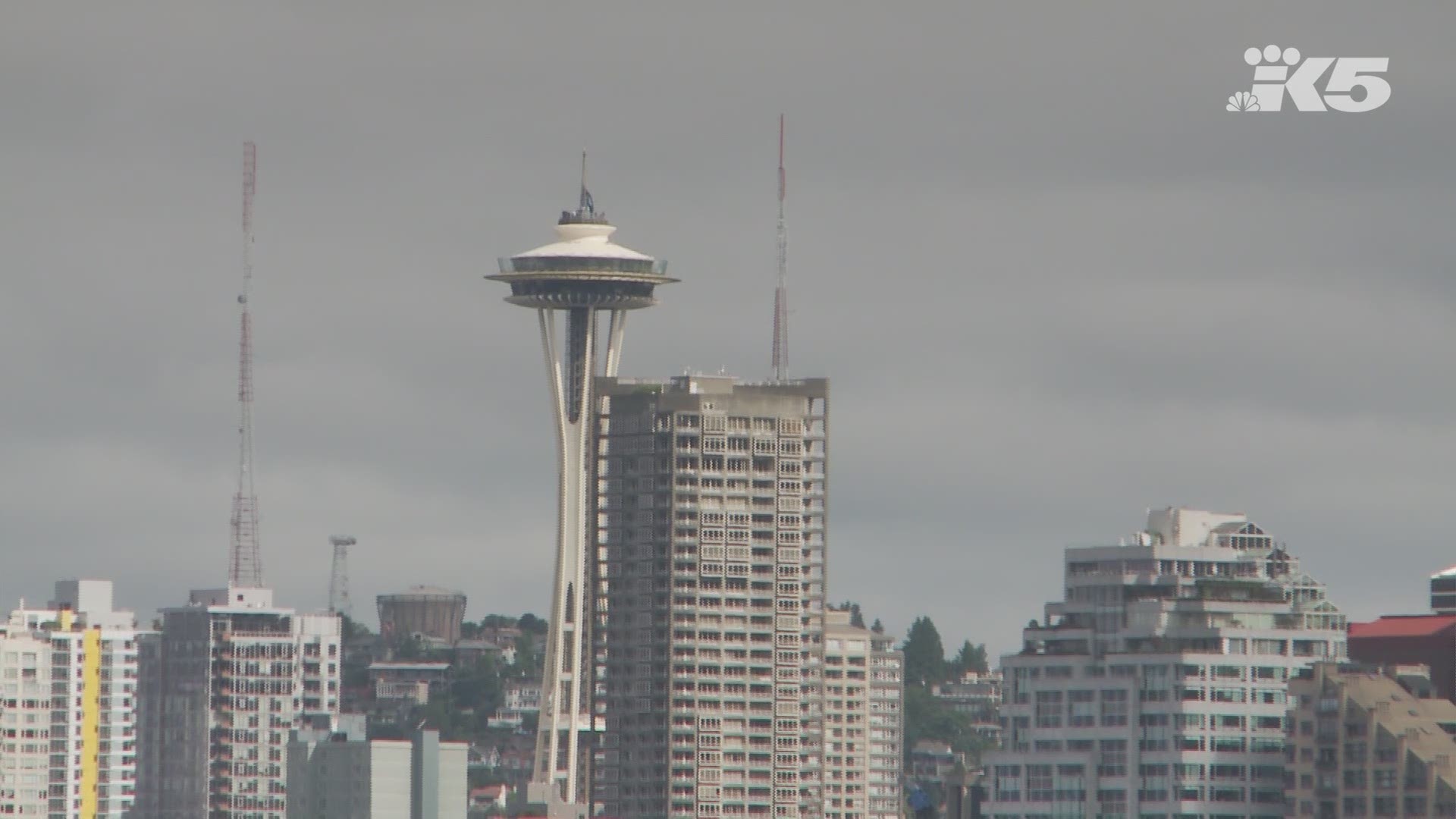Representatives from the Seattle Kraken NHL franchise raised their logo flag above the Space Needle following the team name announcement Thursday.