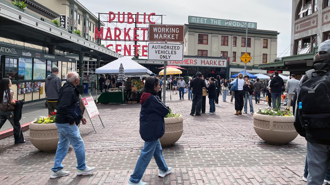 Concrete vehicle barriers arrive at Pike Place Market ahead of World Cup