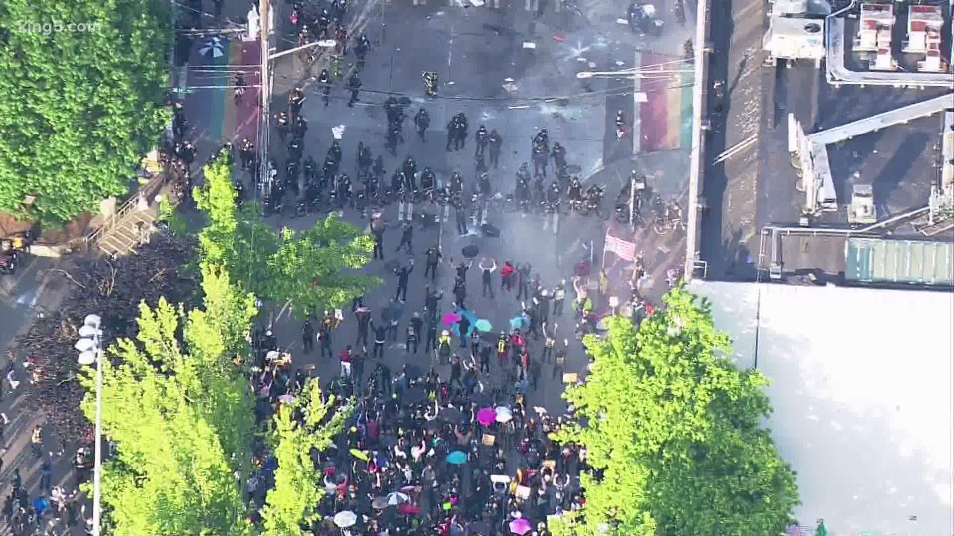 What began as a peaceful protest near Cal Anderson Park has turned tense as Seattle police used crowd control tactics to try and disperse the crowd with flash bangs.