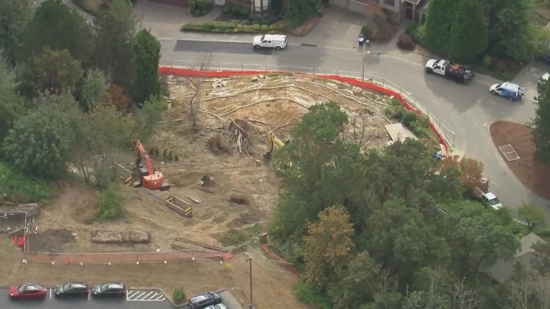 Crews excavated a water pipe Thursday that caused a mudslide earlier this year when it burst, leading to the demolition of a Bellevue family's home.