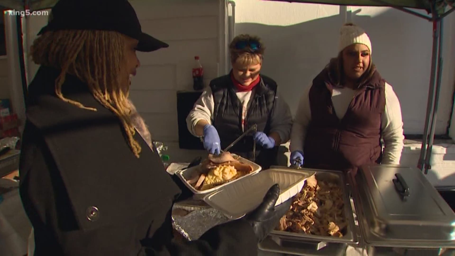 An army of volunteers went out to People's Park in Tacoma on Thanksgiving. They fed dozens of homeless people who are facing a looming tent ban.