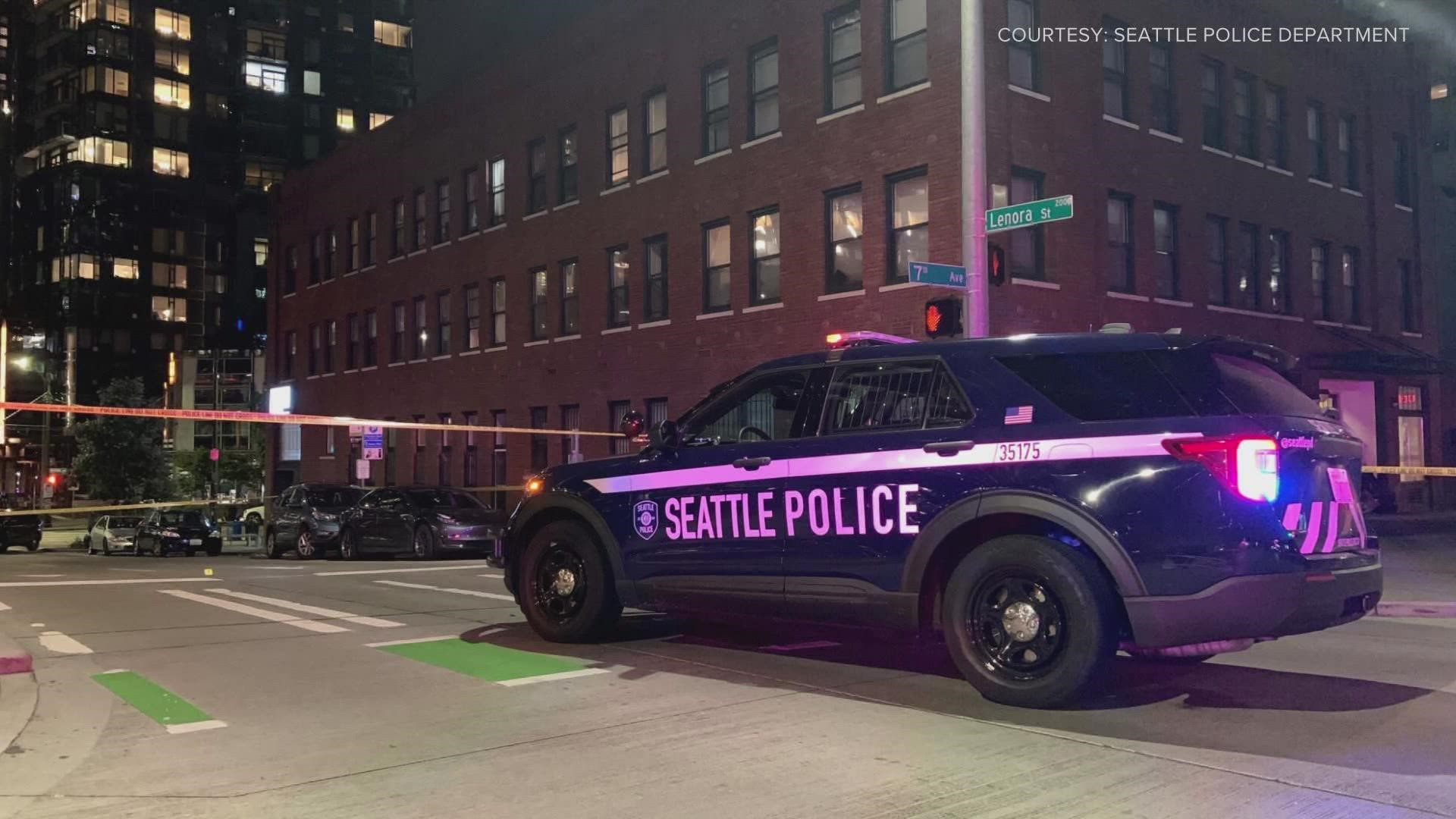 Police are looking for a suspect after a man was shot and killed inside his car in Seattle