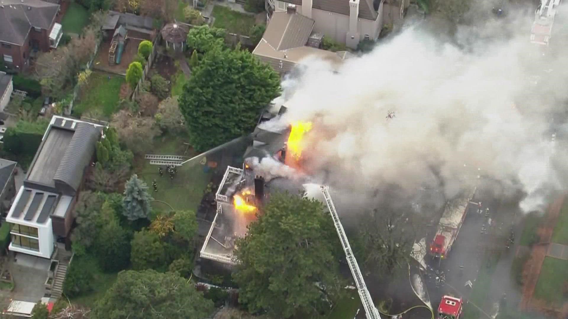 The fire started at a home in the 500 block of West Highland Drive Tuesday afternoon, near Seattle's renowned Kerry Park.