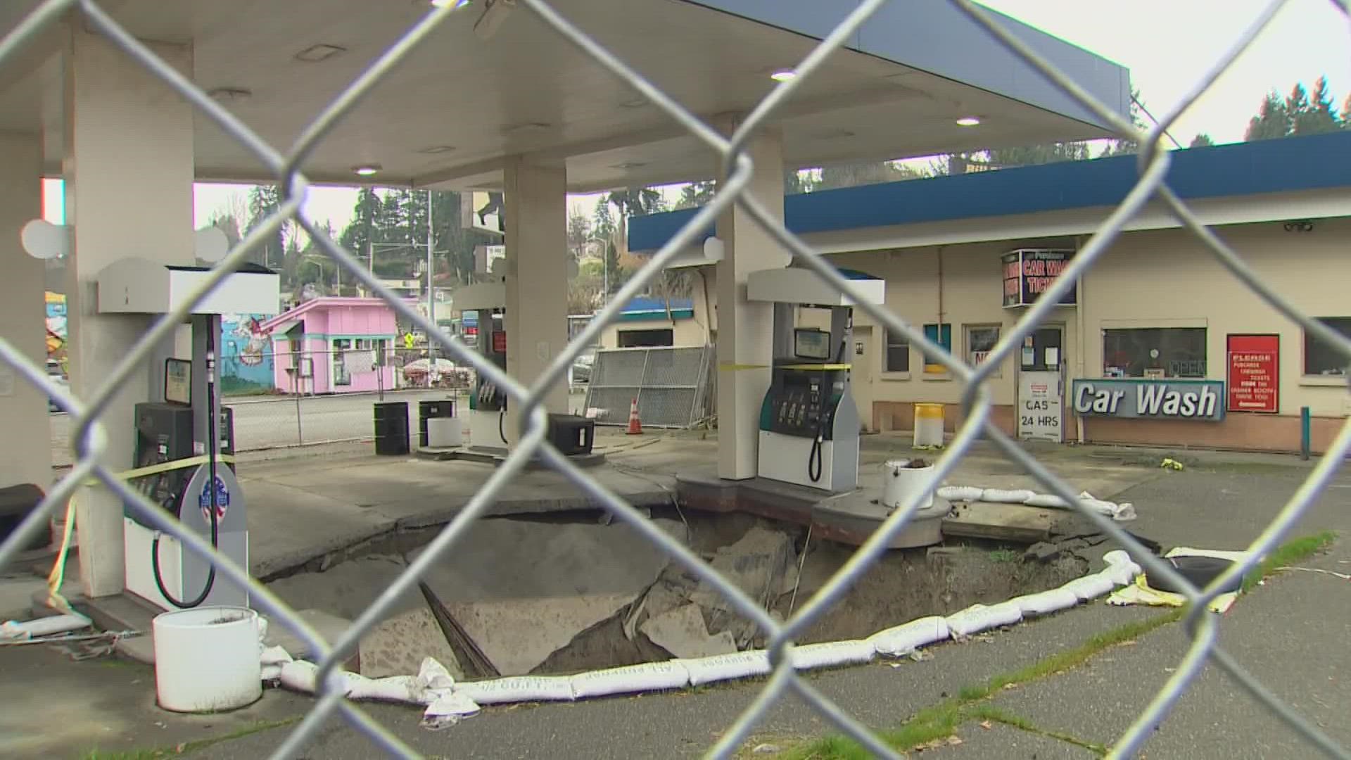 The sinkhole formed a year ago at the gas station next door, but a second sinkhole made the property owners decide to demolish the structures.