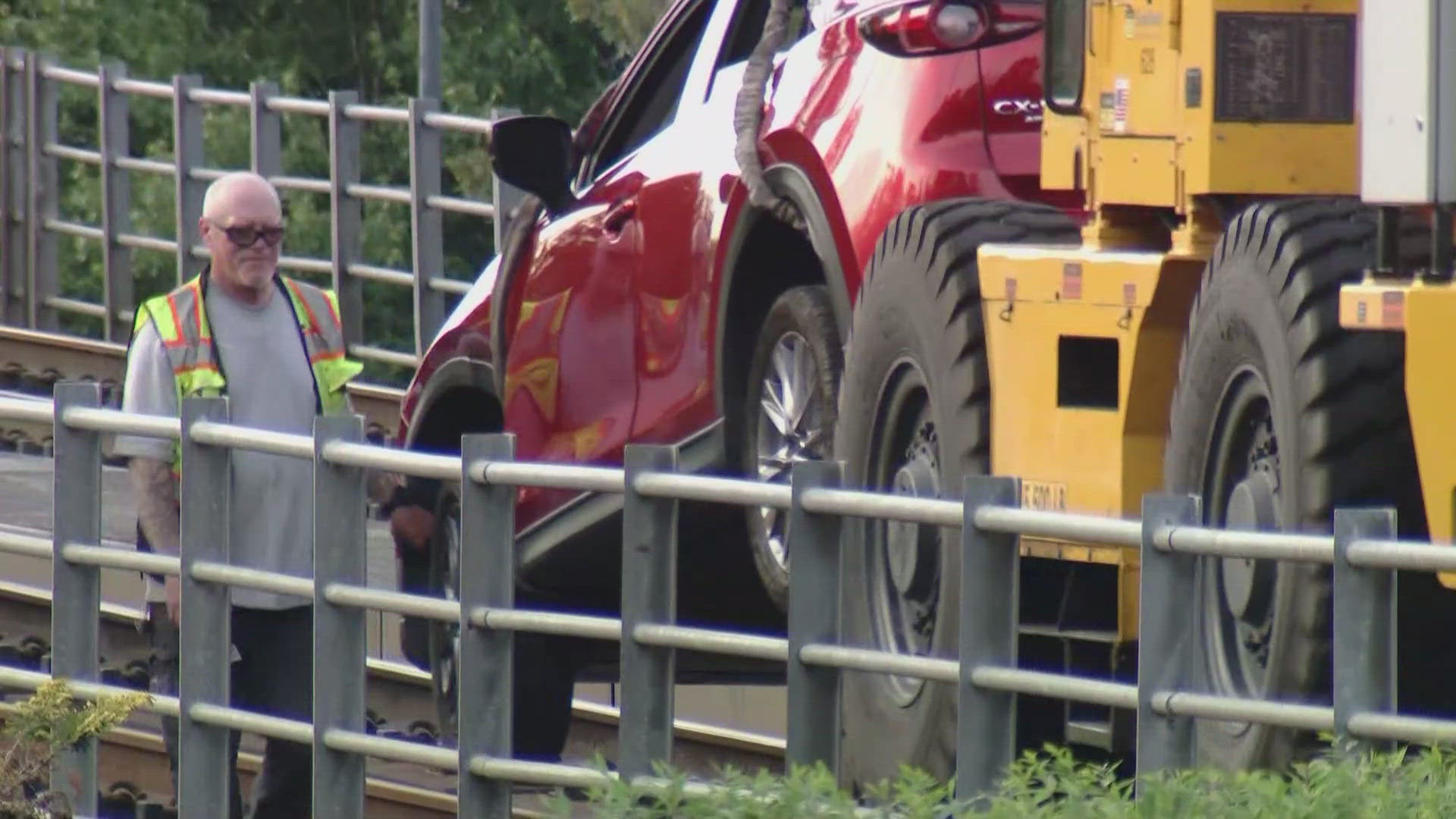 The 70-year-old driver was able to exit the car after driving onto elevated light rail tracks in Seattle on June 2.