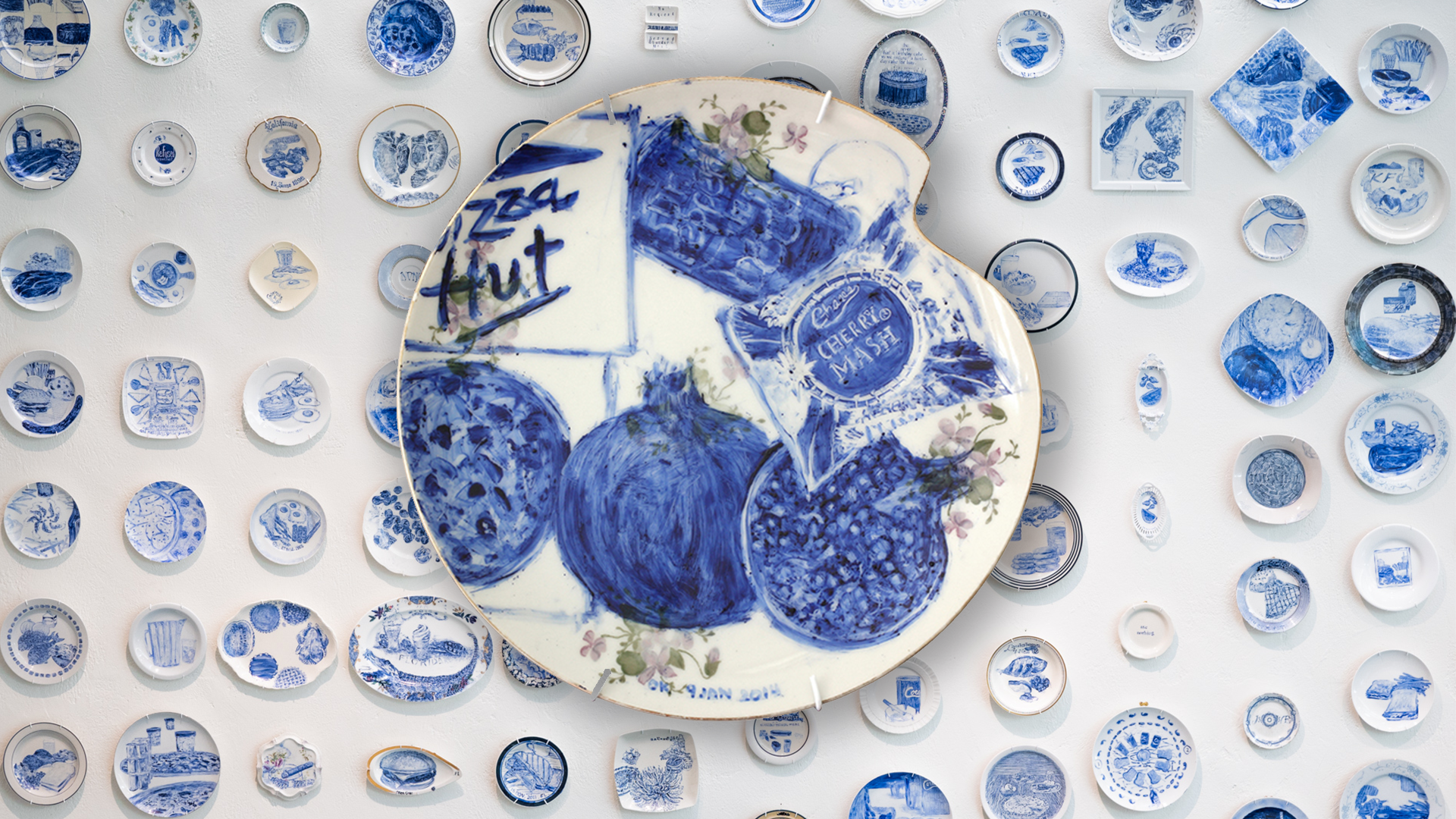 800 plates memorialize inmates' last meals and bring empathy and enlightenment to the issue of capital punishment. On view at Bellevue Art Museum through Oct, 2021.